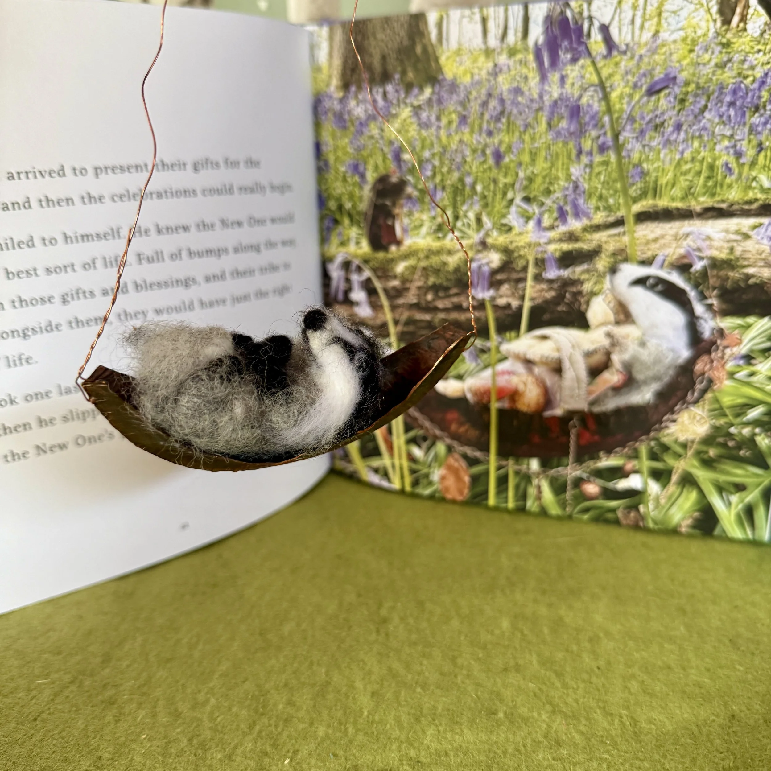 Baby badger in a copper crib boat 