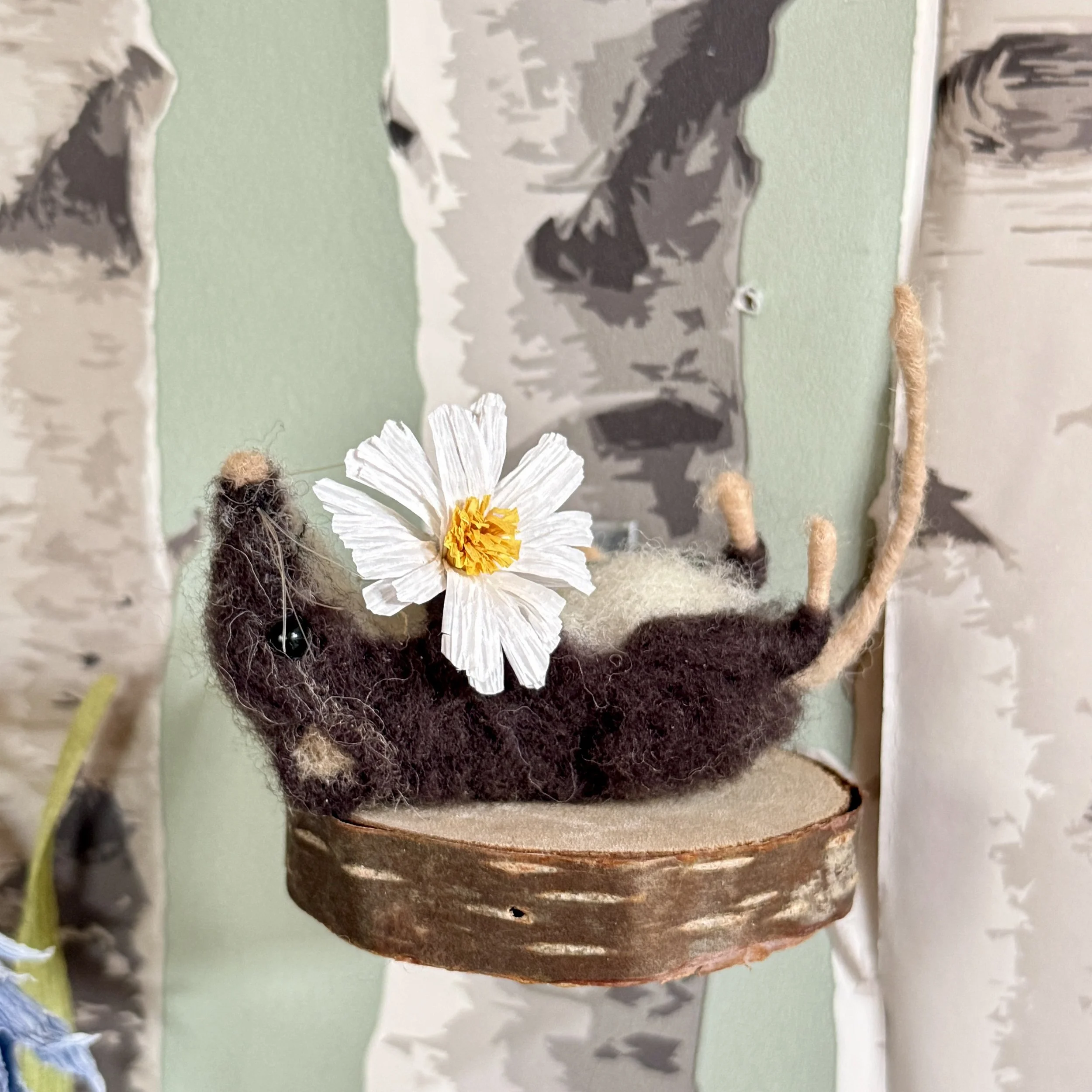 Lying back with the daisies from the gift gatherers book illustrations. Little felted shrew with a handmade plant dyed crepe paper daisy flower (paper from Paper by dragonfly Ling Approx 7cm long £126