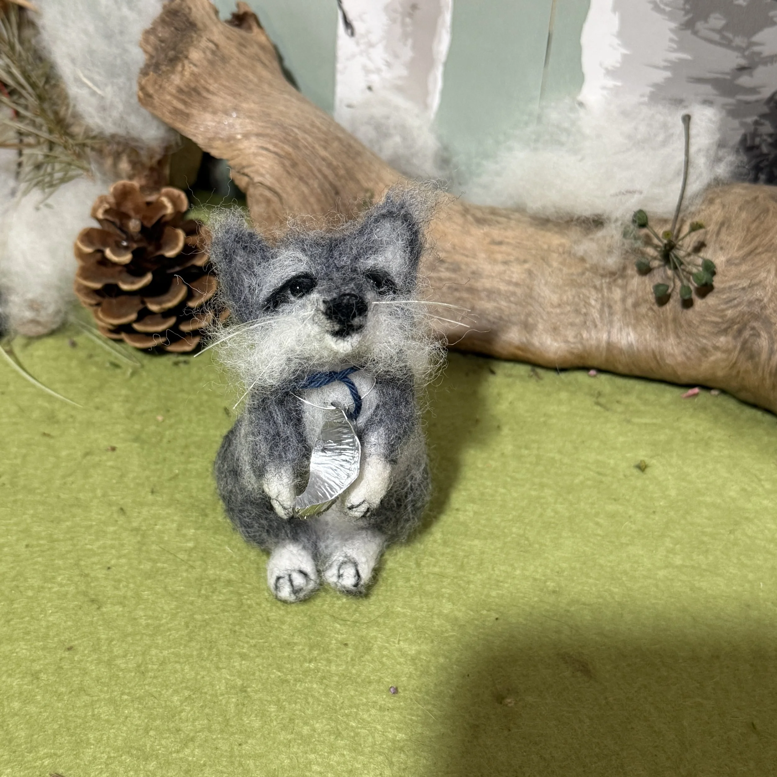 Baby Wolf Cub howling at the moon.  
Wolf cub 3 needle felted approx 11cm high  with a little hand beaten metal moon round their neck and a piece of blue yarn to help you see which is which in photos . £130 