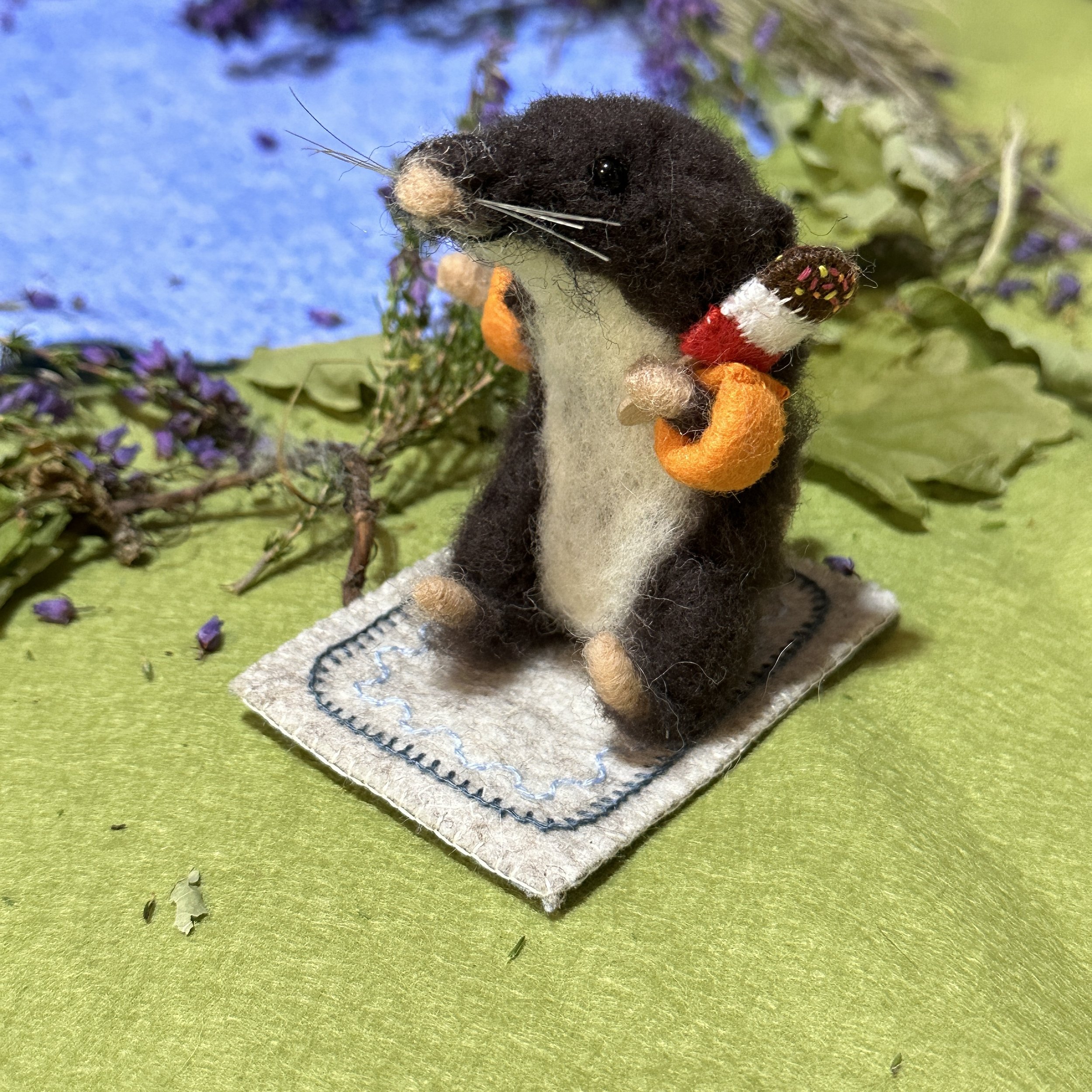 Baby Shrew on a rug