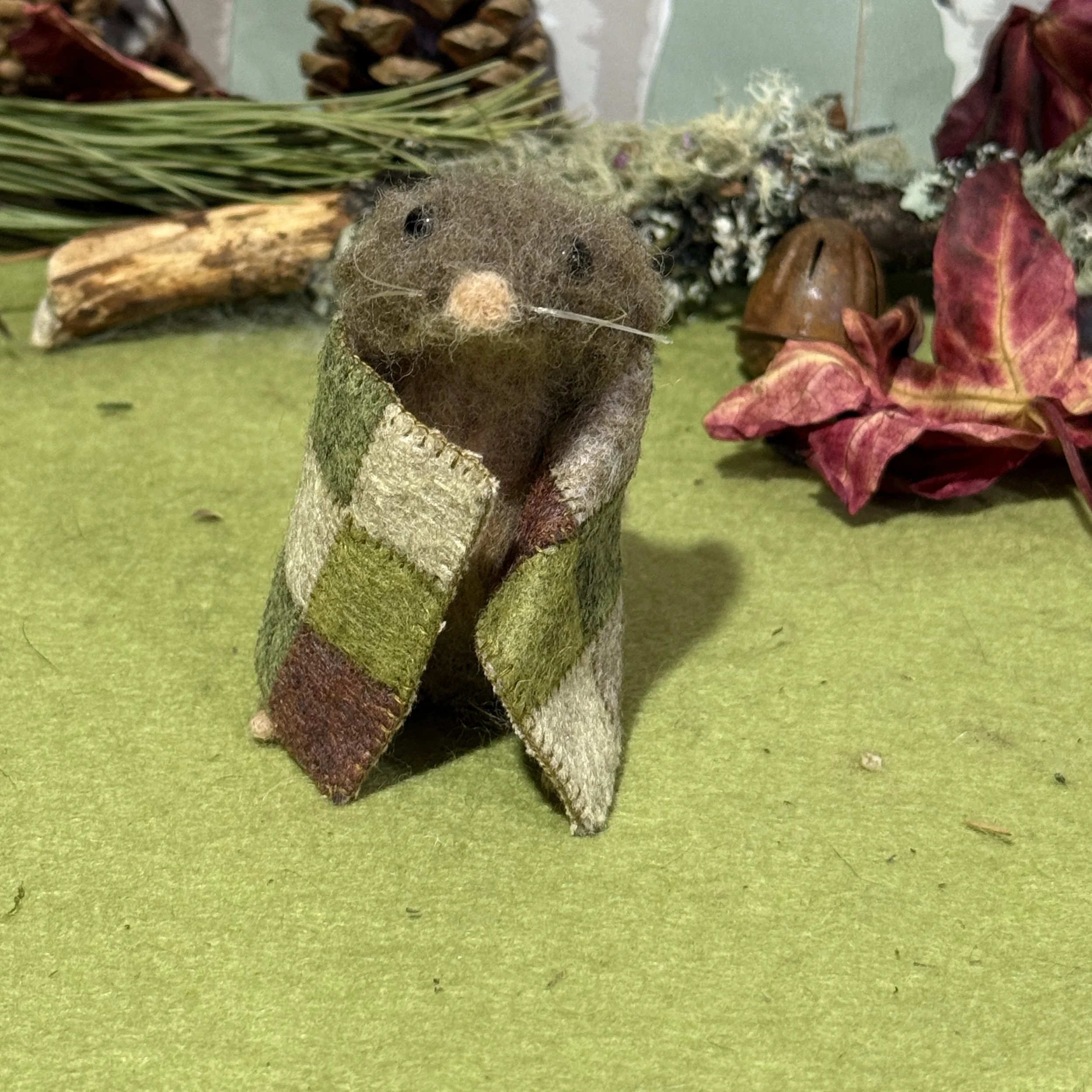 Mouse with a patchwork quilt.