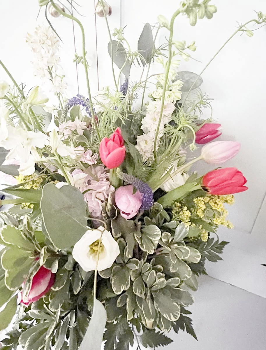 Close-up of Parisian collection flowers featuring tulips, sweet-smelling stock, veronica, and solidago in a European design.