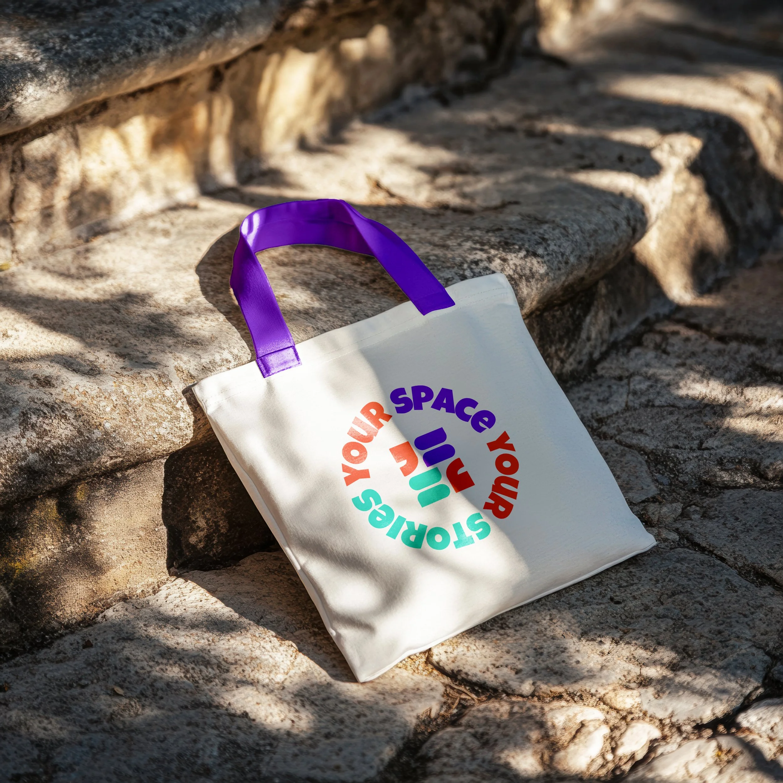 Canvas tote bag mockup with a purple handle featuring the circular submark logo designed for YSYS