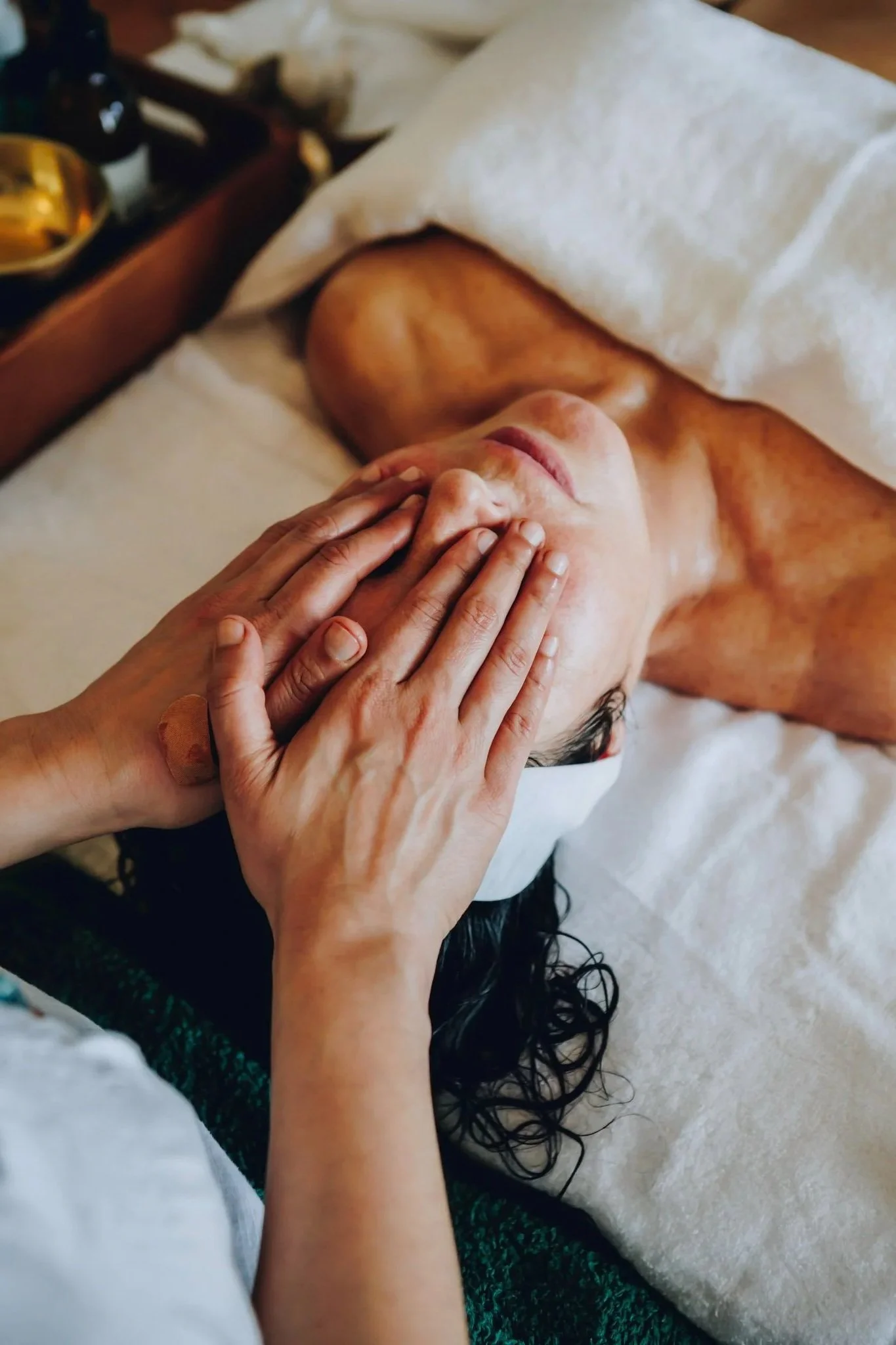 Ayurvedic Face Massage Relaxing client