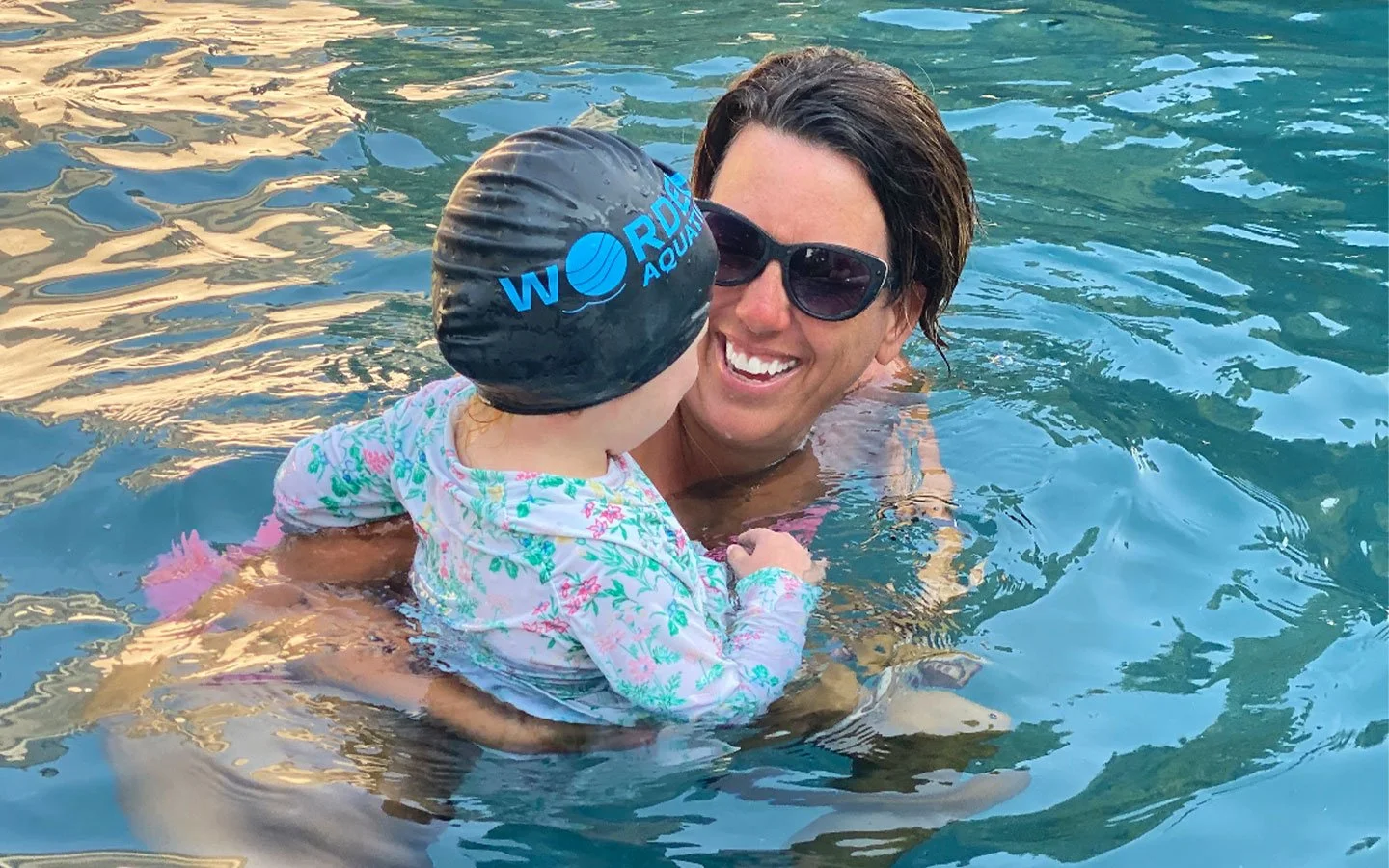 Owner, Lauren Worden, teaching a swim lesson student at Worden Aquatics.