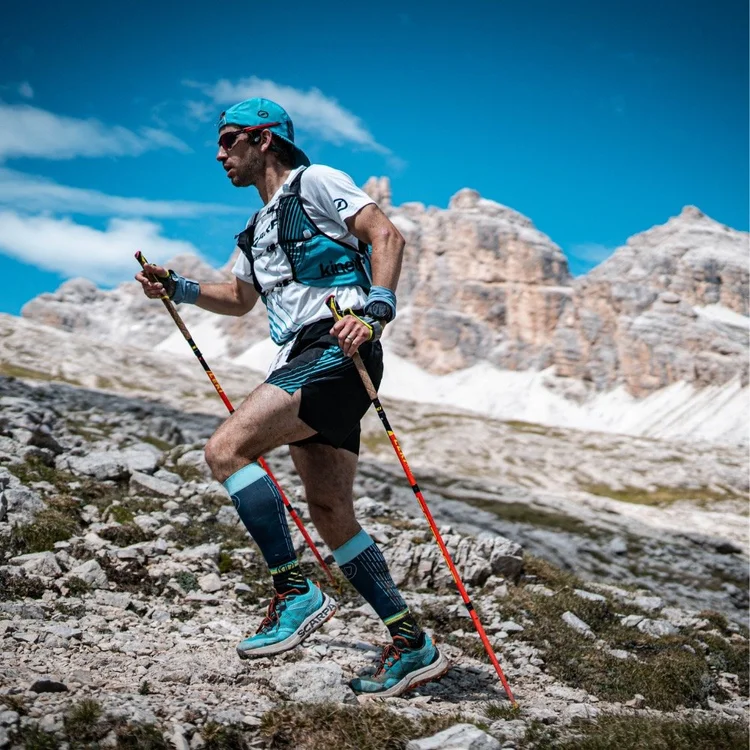Tim hiking with poles in the mountains