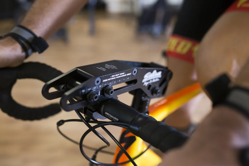 An adjustable fitting stem on the handlebars of a road bike during a bike fit