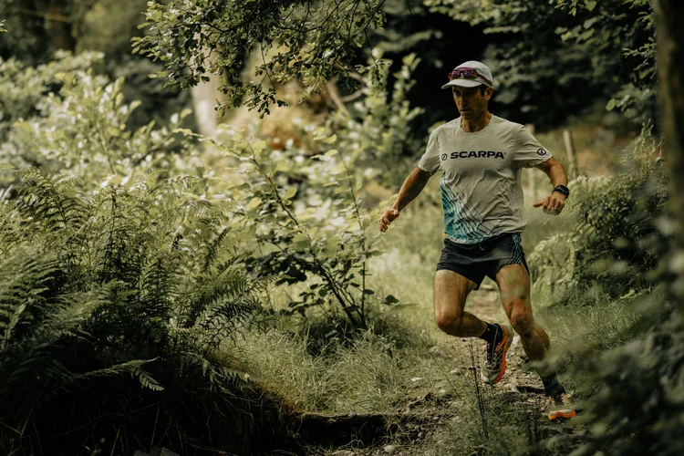 Tim trail running in the woods