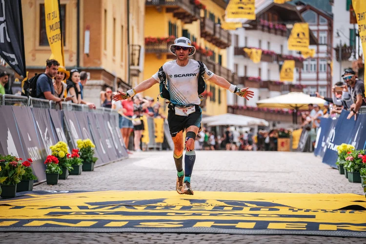 Tim finishing a mountain race in an alpine town