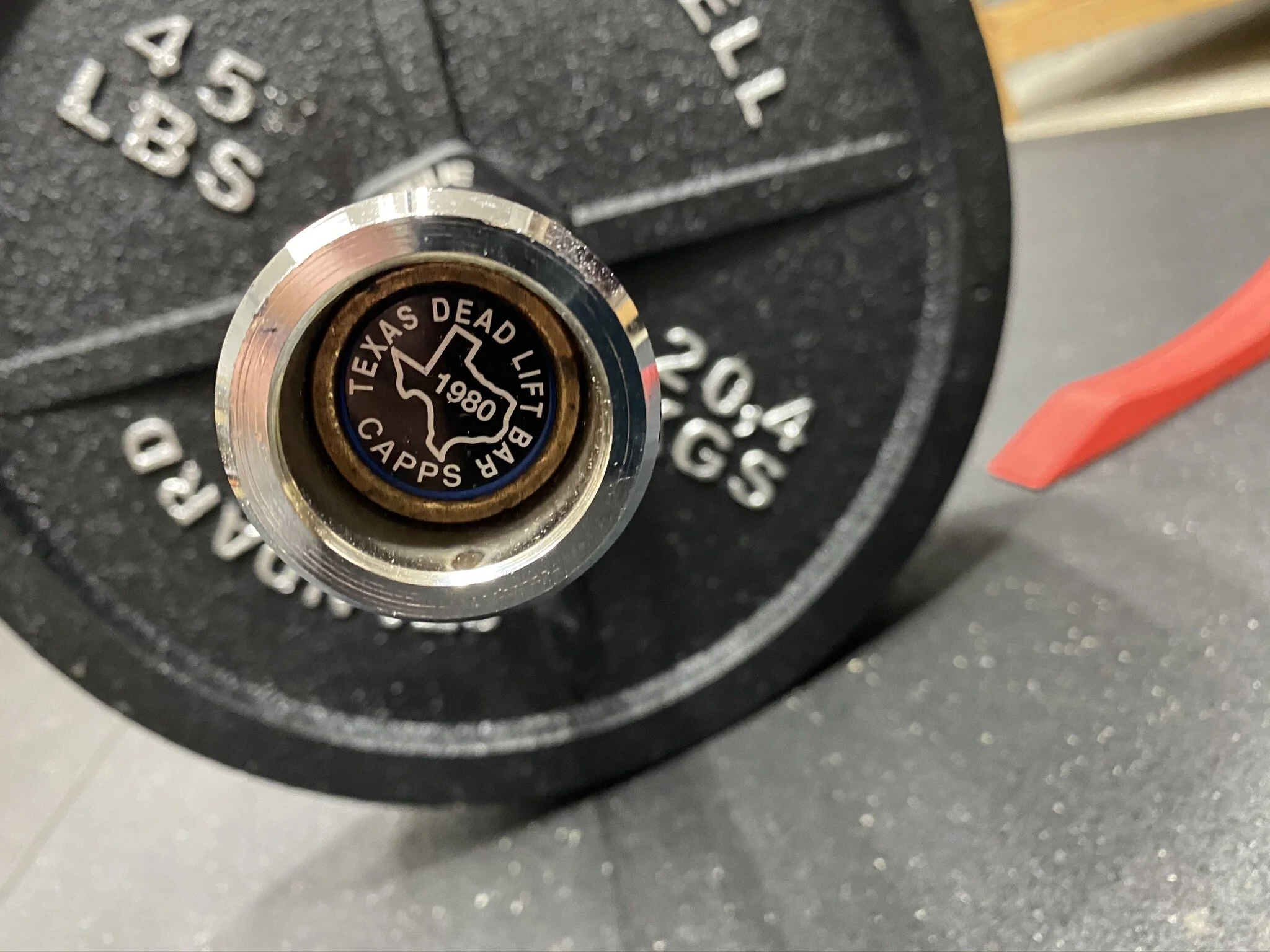 texas deadlift bar with weight plates.jpeg