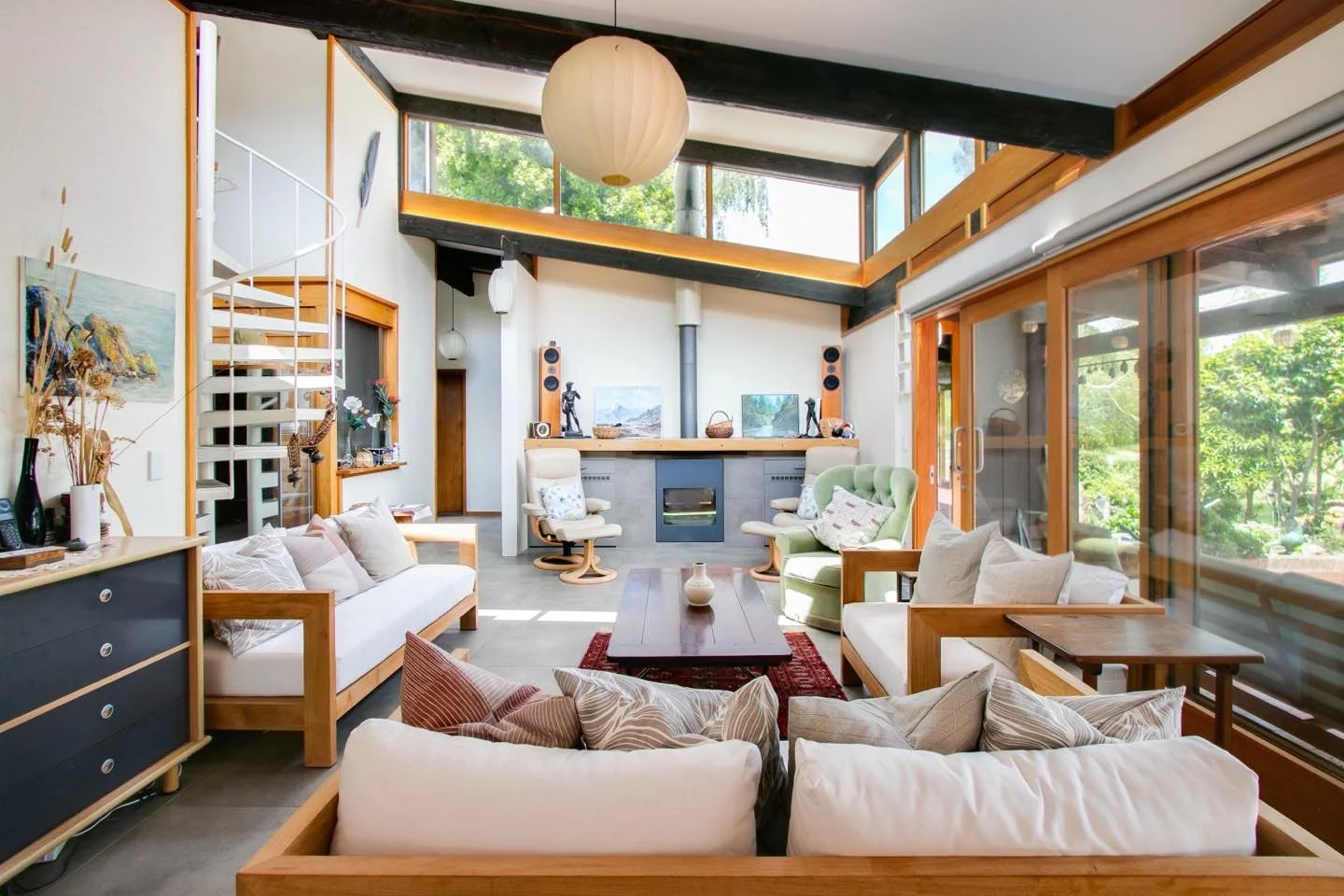 This stunning home boasts natural light and a toasty warm fireplace. We enjoyed retaining &amp; celebrating its iconic modernism.