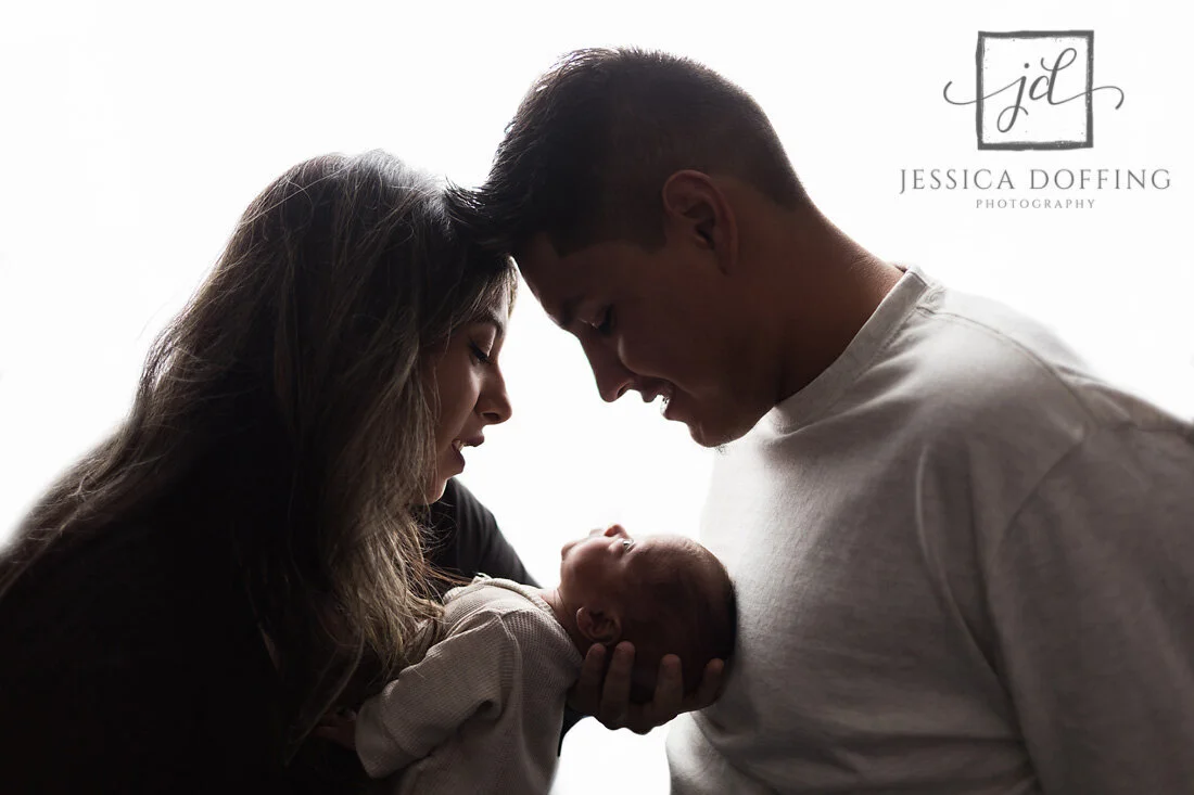 Parents holding their newborn son, Baby Madx, during his Austin newborn photography session after his diagnoses of Hydranencephaly and Diabetes Insipidus.