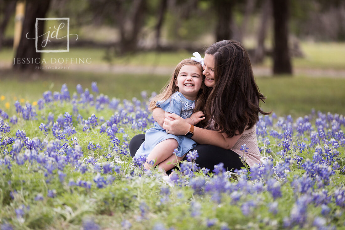 mom daughter laughing bluebonnets