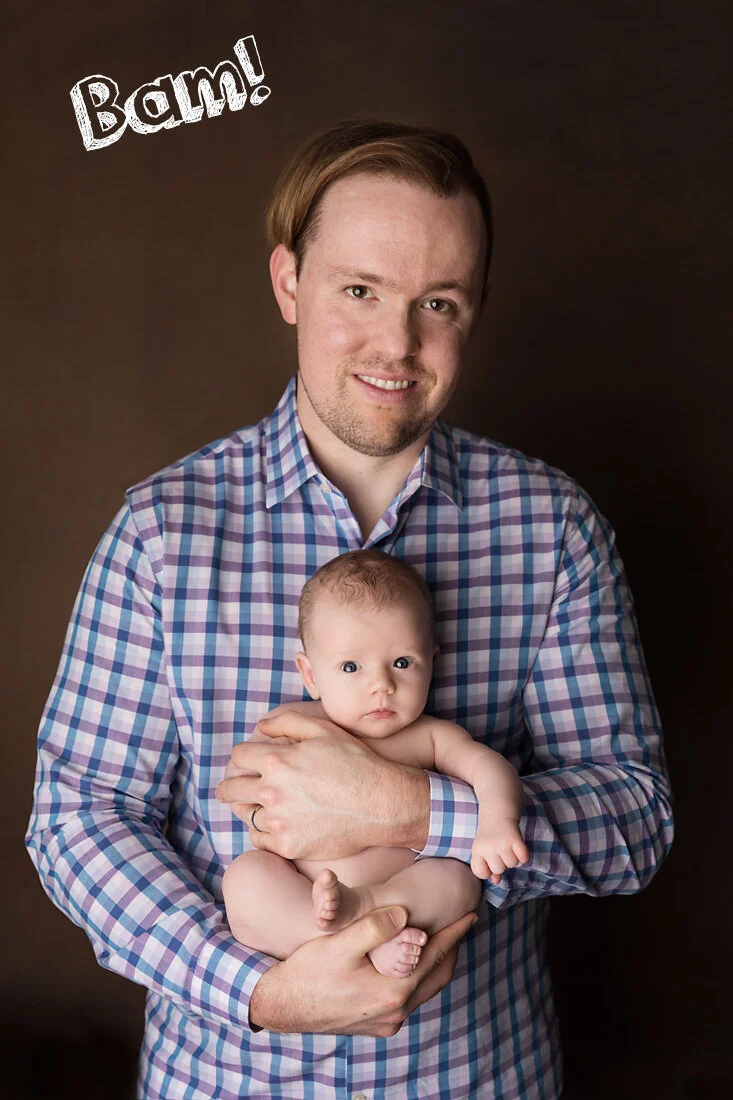 Awake newborn baby making eye contact with the camera while being held by dad during a studio newborn photography session in Austin, Texas.