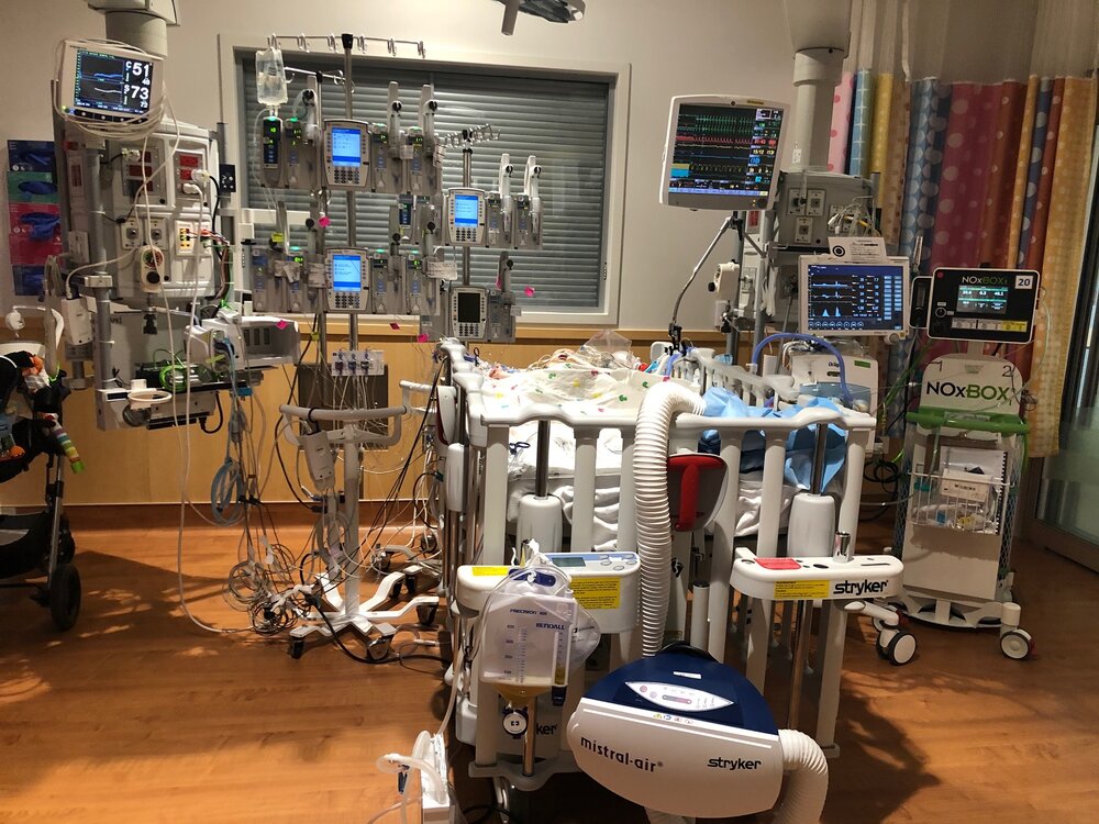 Noah’s ICU room and set up.  Lots of beeps. Alarms.  Noises. Mom (and dad when he wasn’t having to travel for work) slept right beside him every night for the 6 months we were in/out of the ICU. 