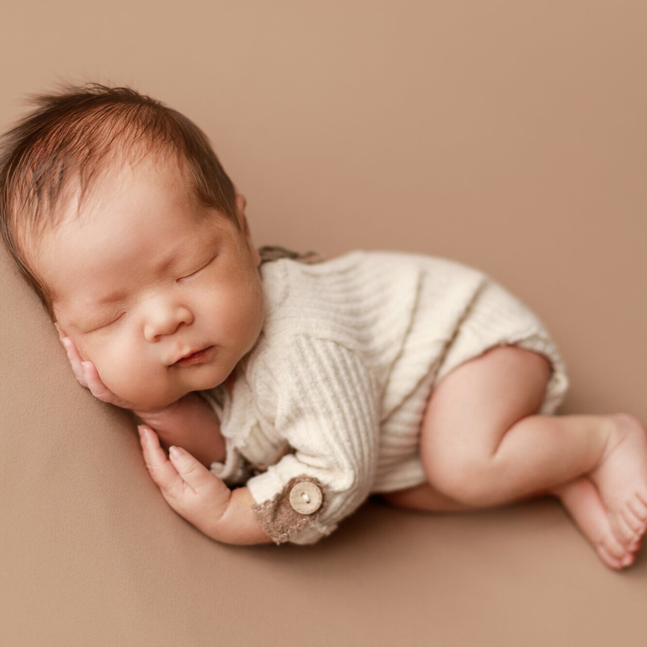newborn boy in side-lying pose