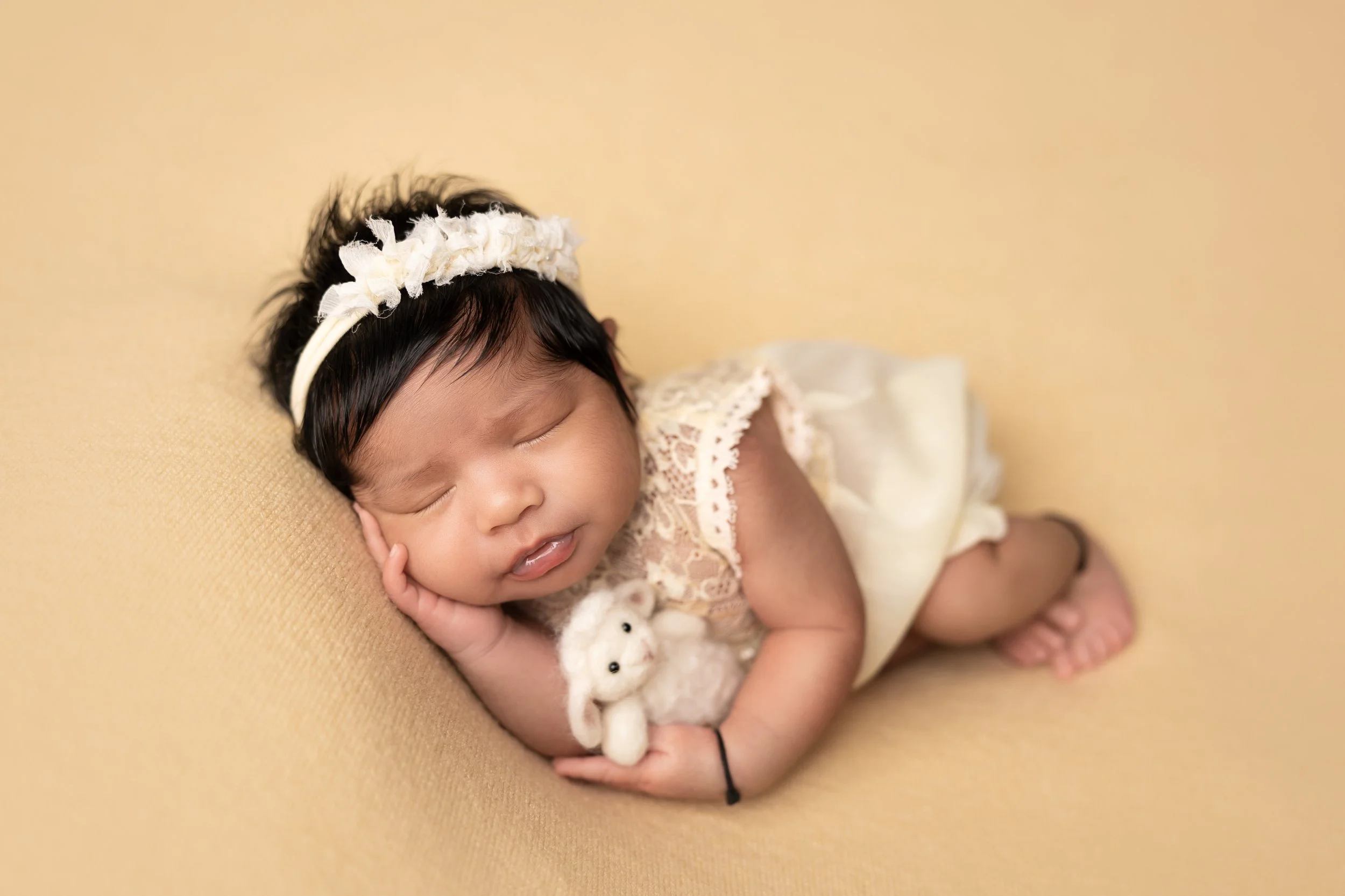 newborn-side-lying-pose-cream-outfit.jpg