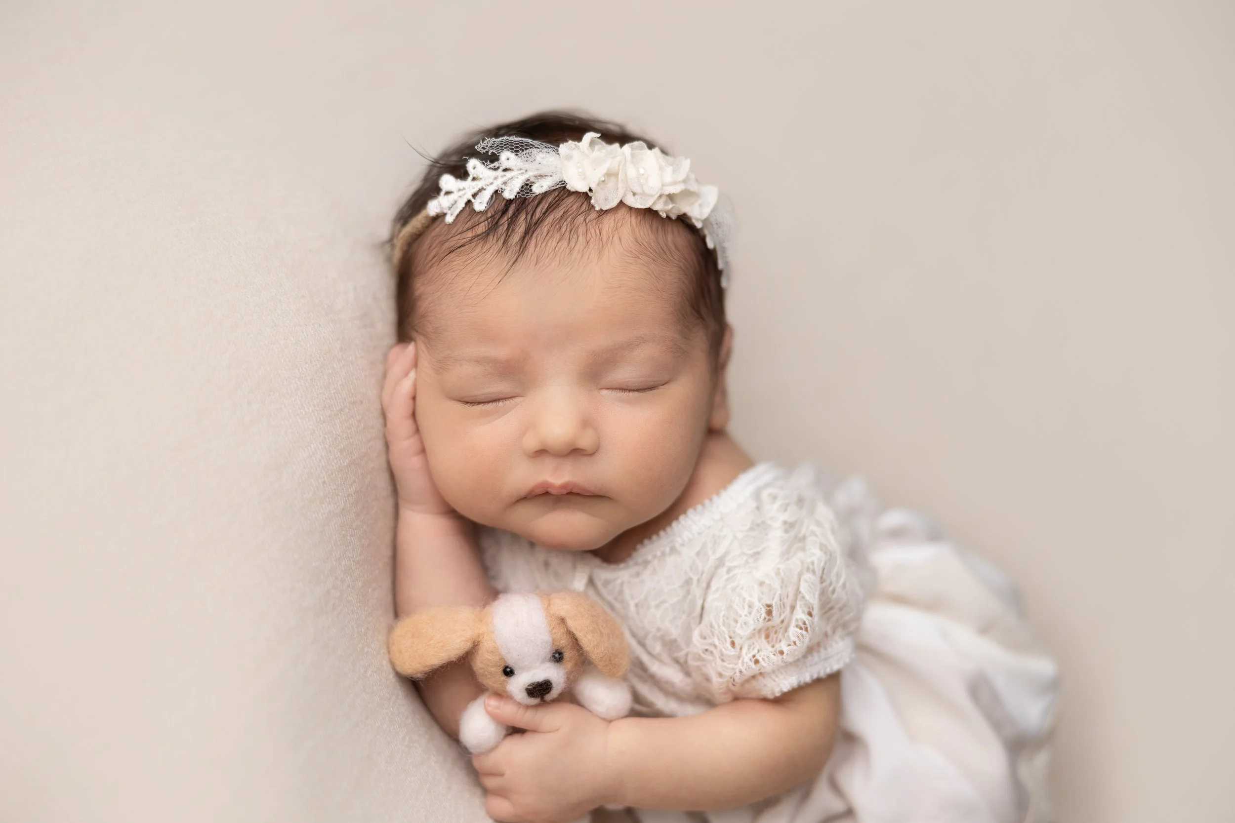 newborn-photography-side-lying-teddy.jpg