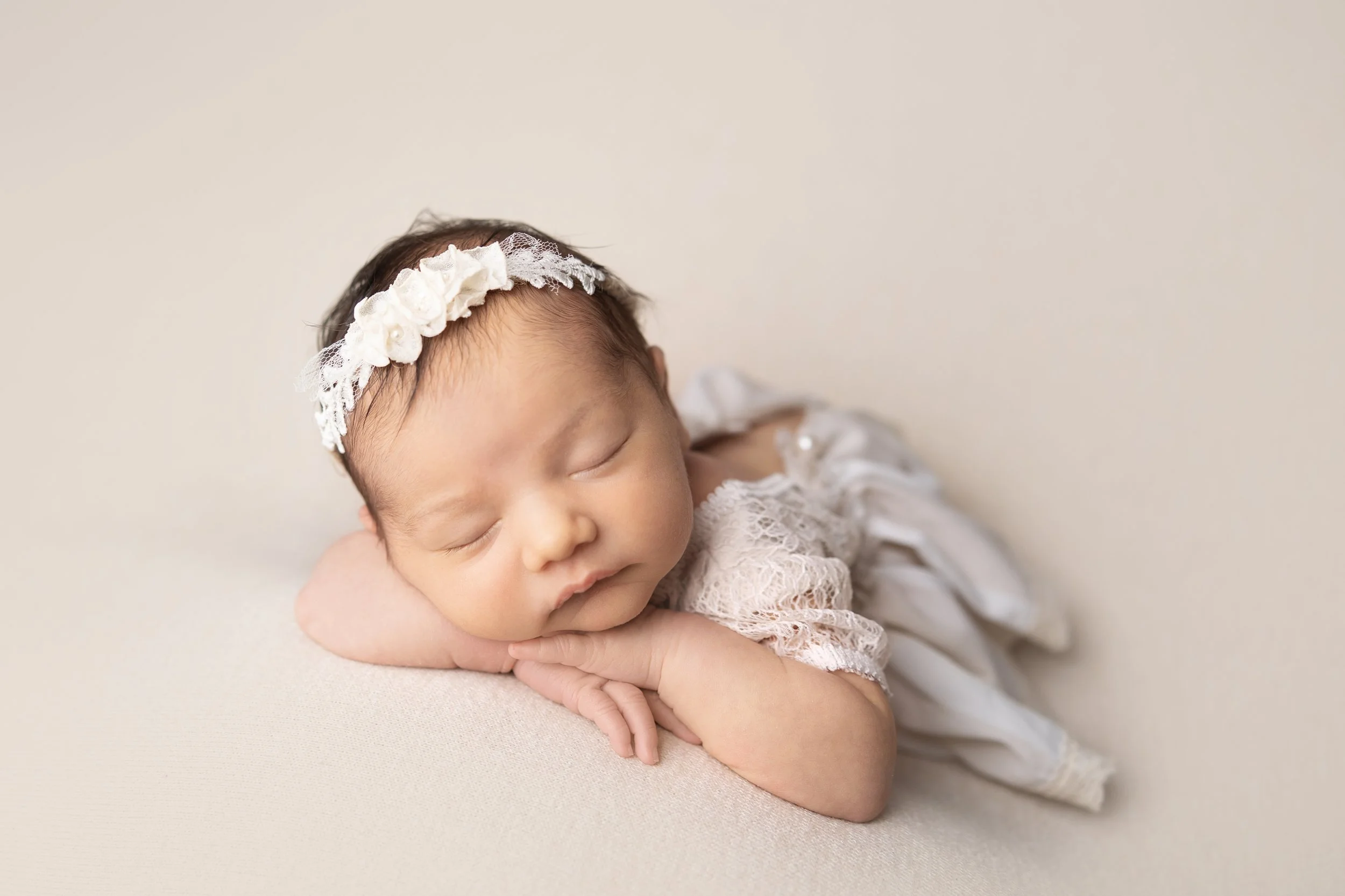 newborn-photography-chin-on-hands-pose.jpg