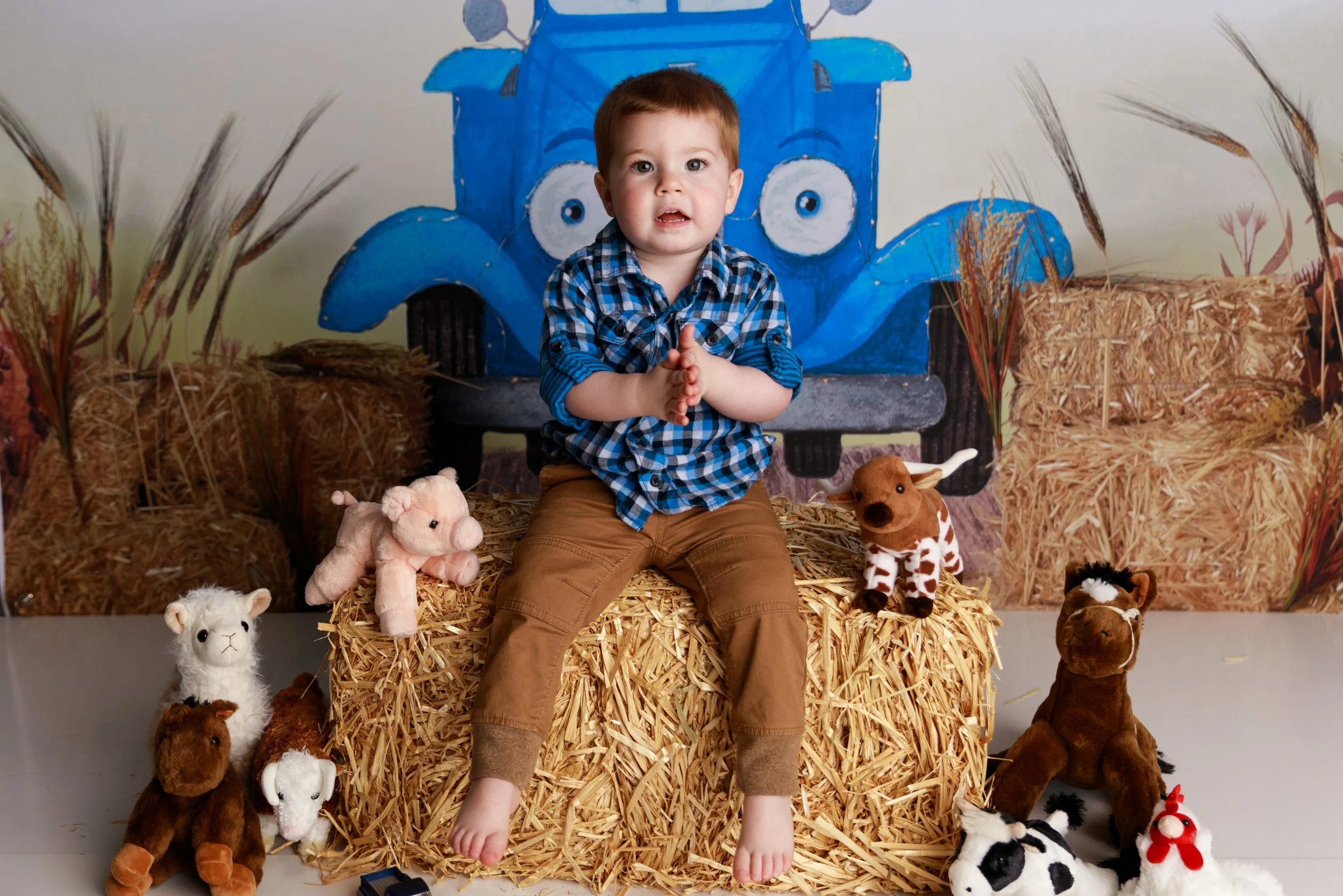 little blue truck themed toddler birthday photoshoot idea