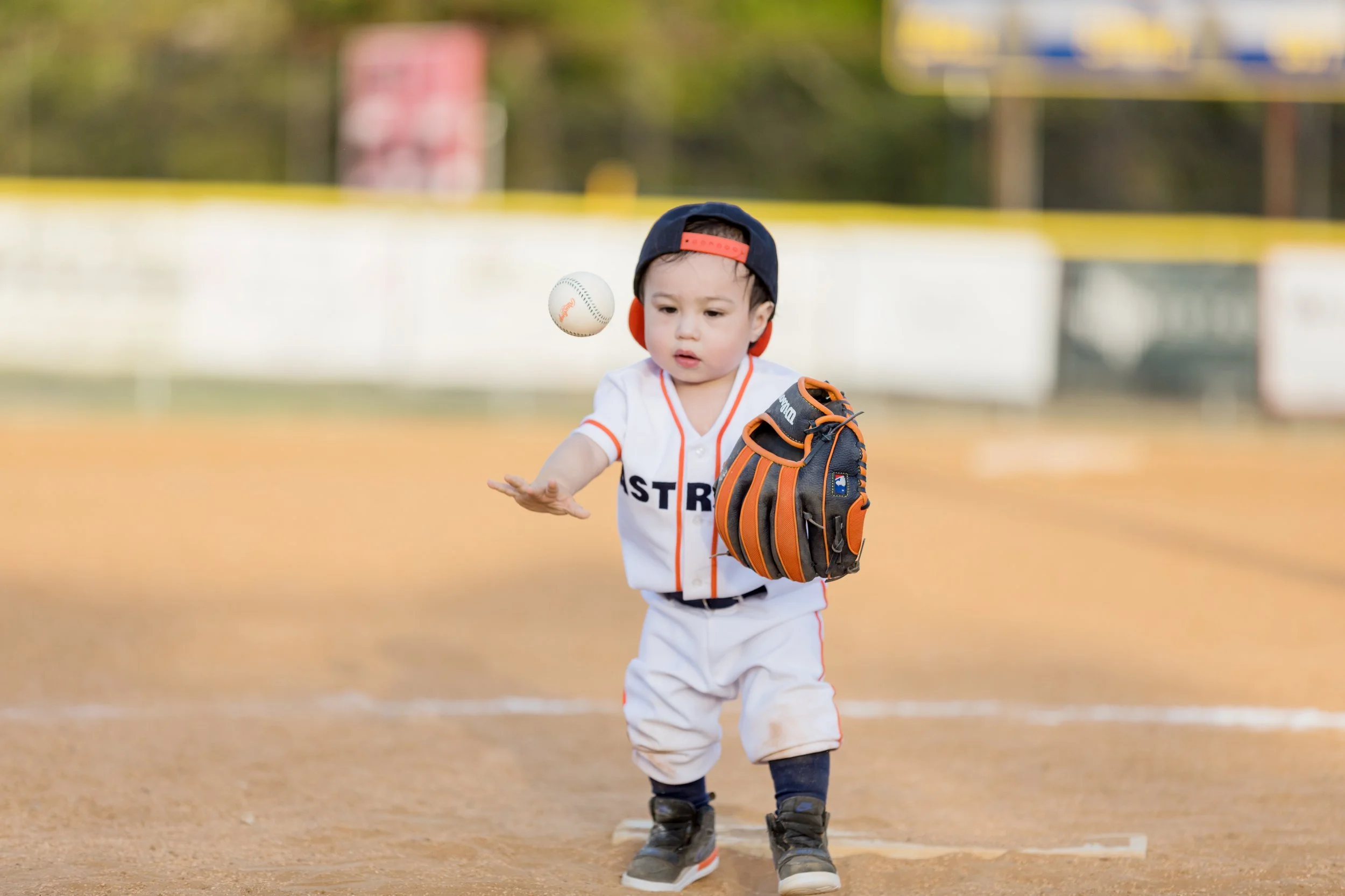 toddler-throwing-baseball-candid.jpg