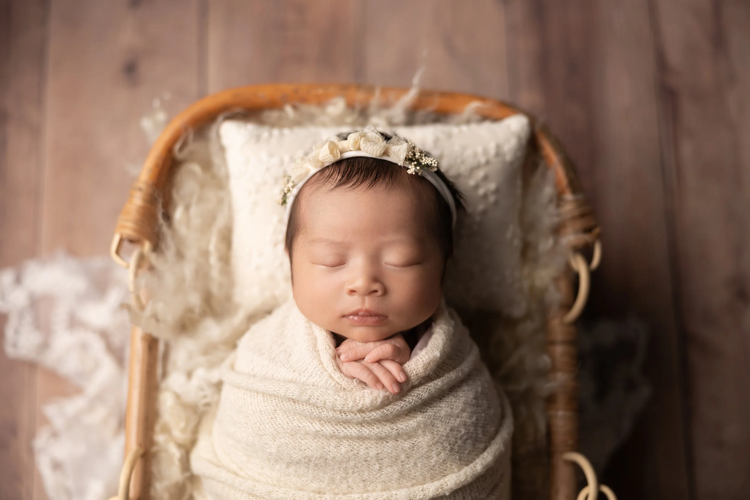 neutral newborn wrapped in cream