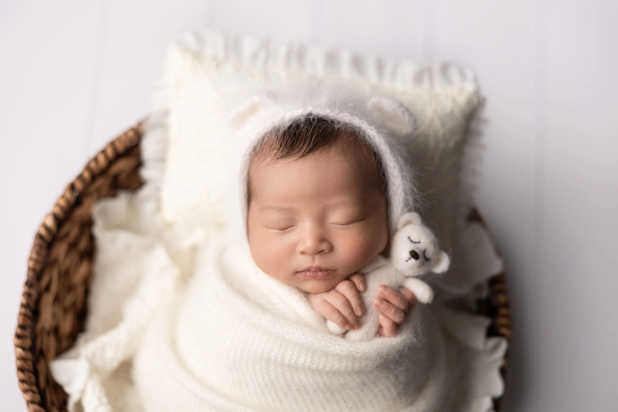 soft neutral newborn studio pose