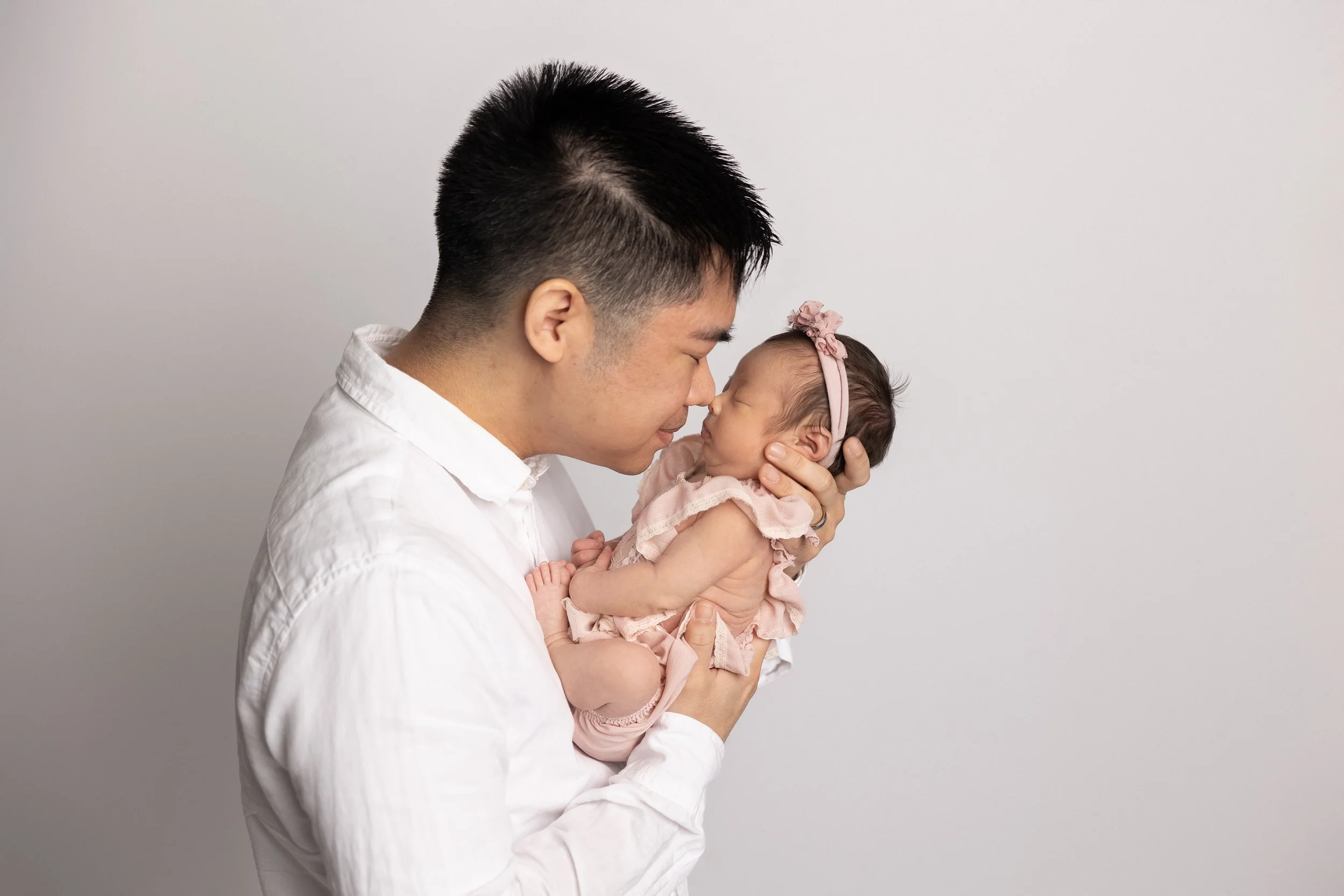 dad with newborn simple portrait