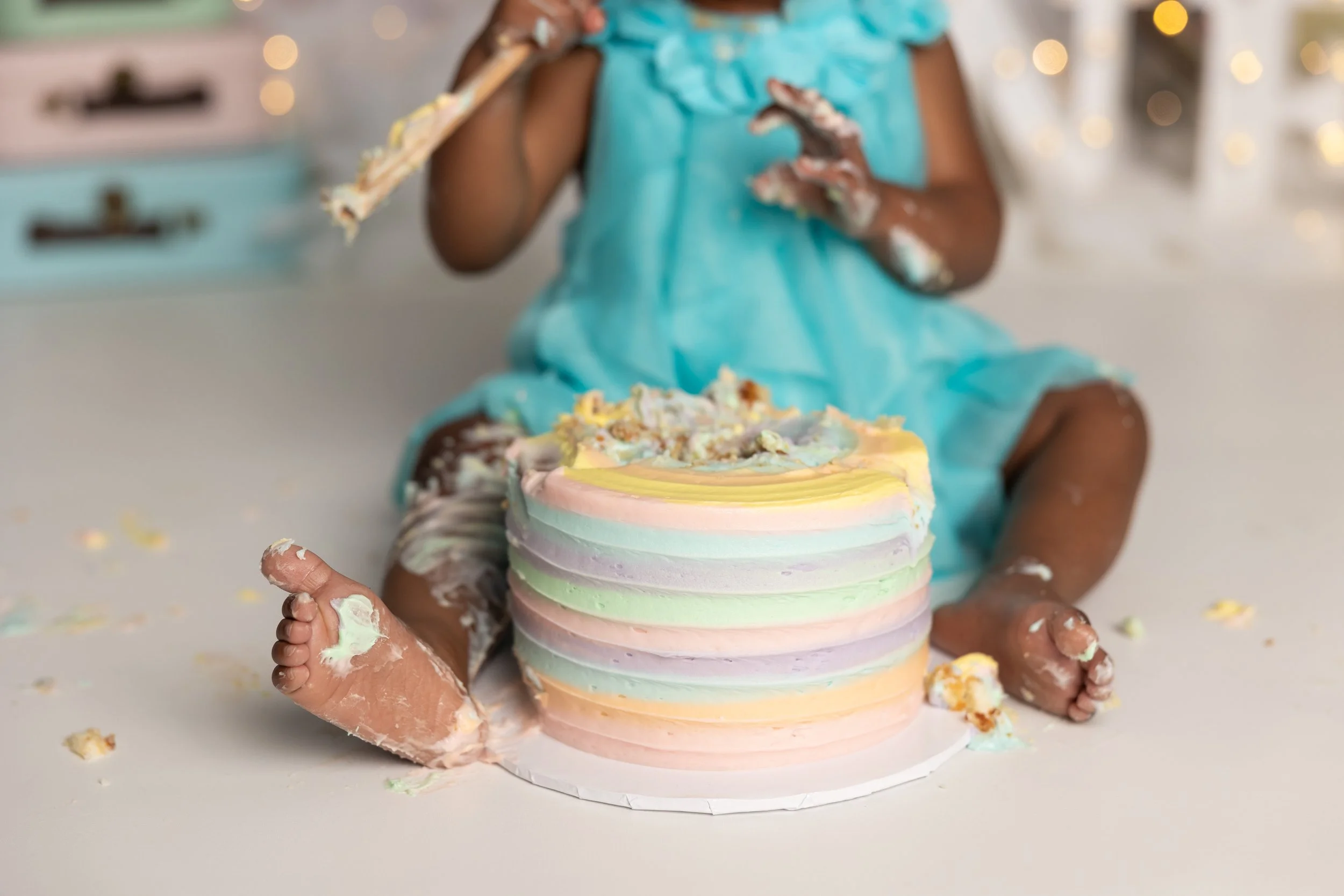 Oh The Places You’ll Go cake smash – rainbow cake first birthday session