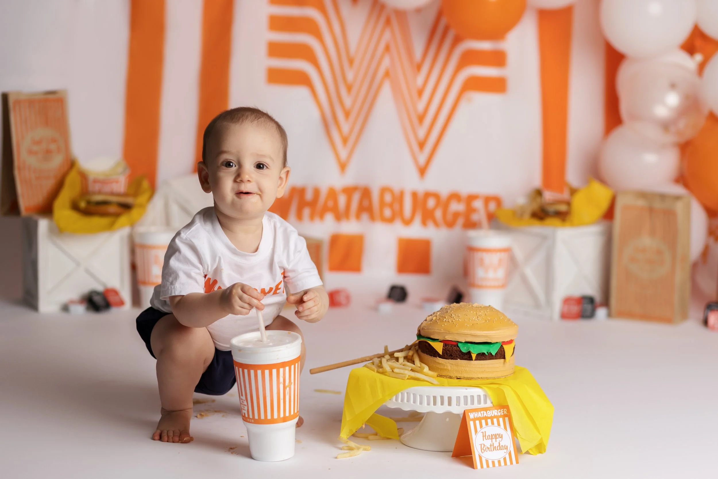 Whataburger cake smash – first birthday boy with burger cake and fries setup