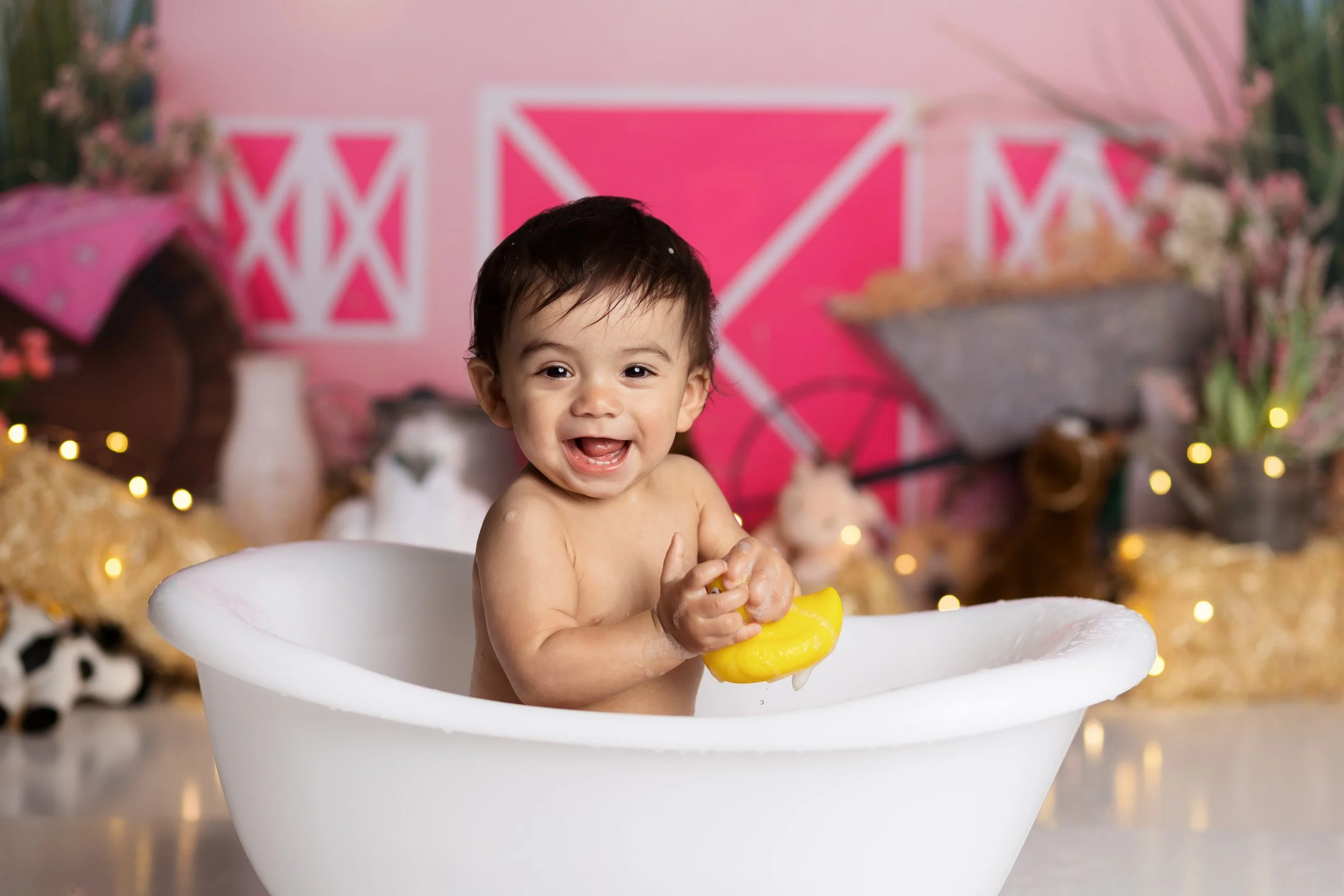 Cake smash bath photo – pink cowgirl theme first birthday session