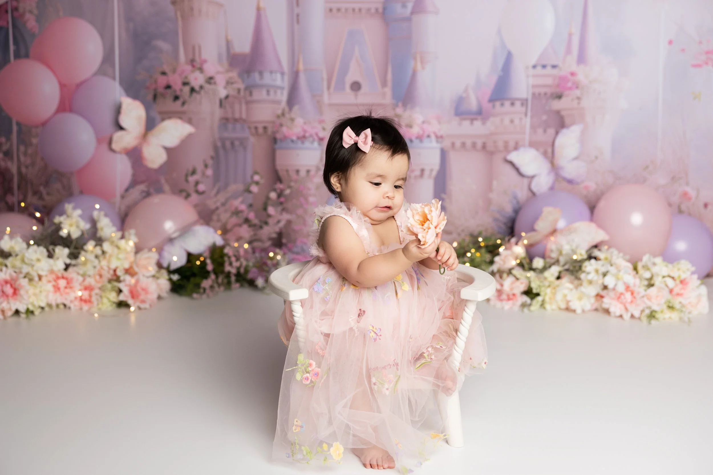 Princess castle cake smash theme – first birthday girl portrait with pastel setup
