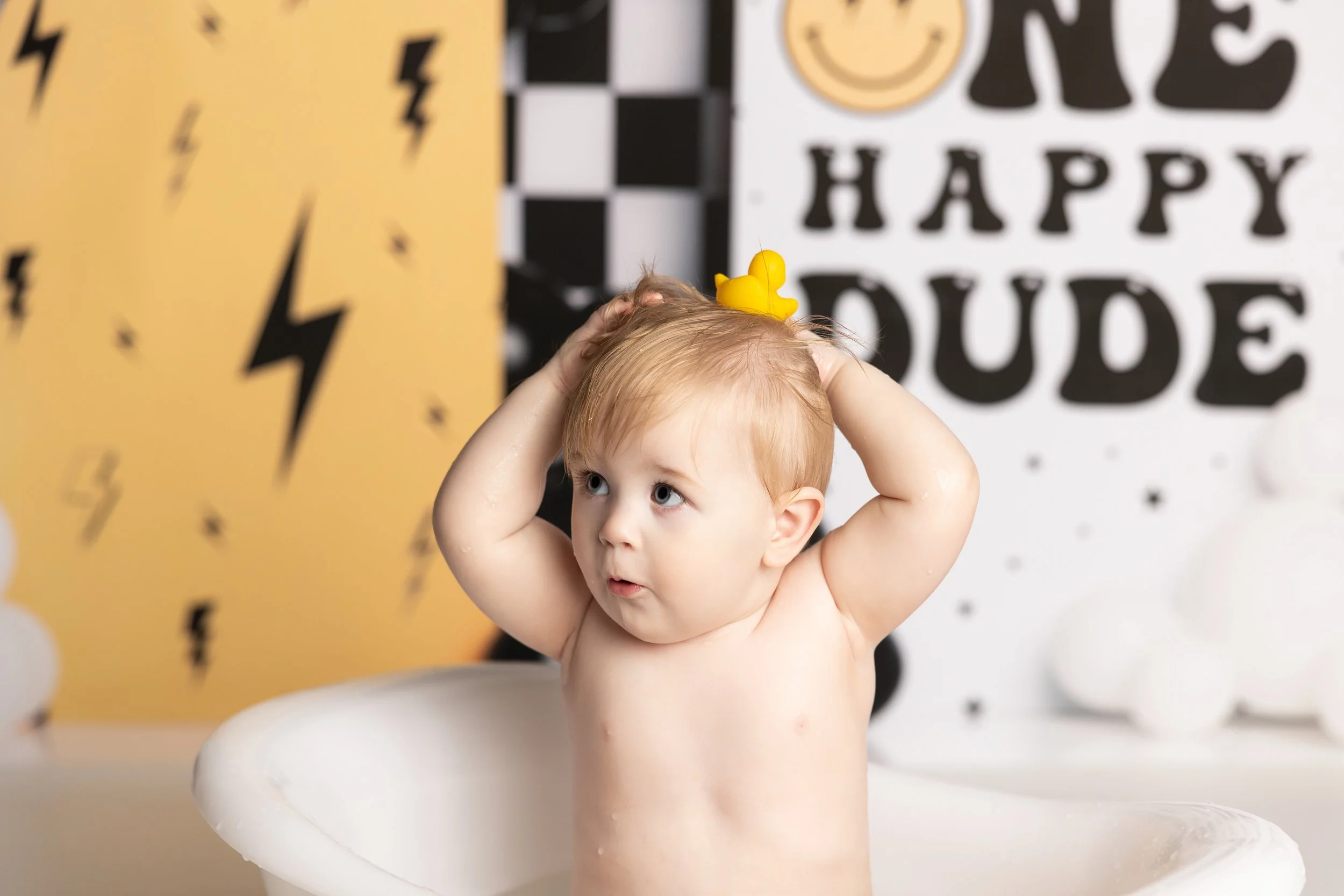 One Happy Dude cake smash theme – first birthday boy playful close-up portrait