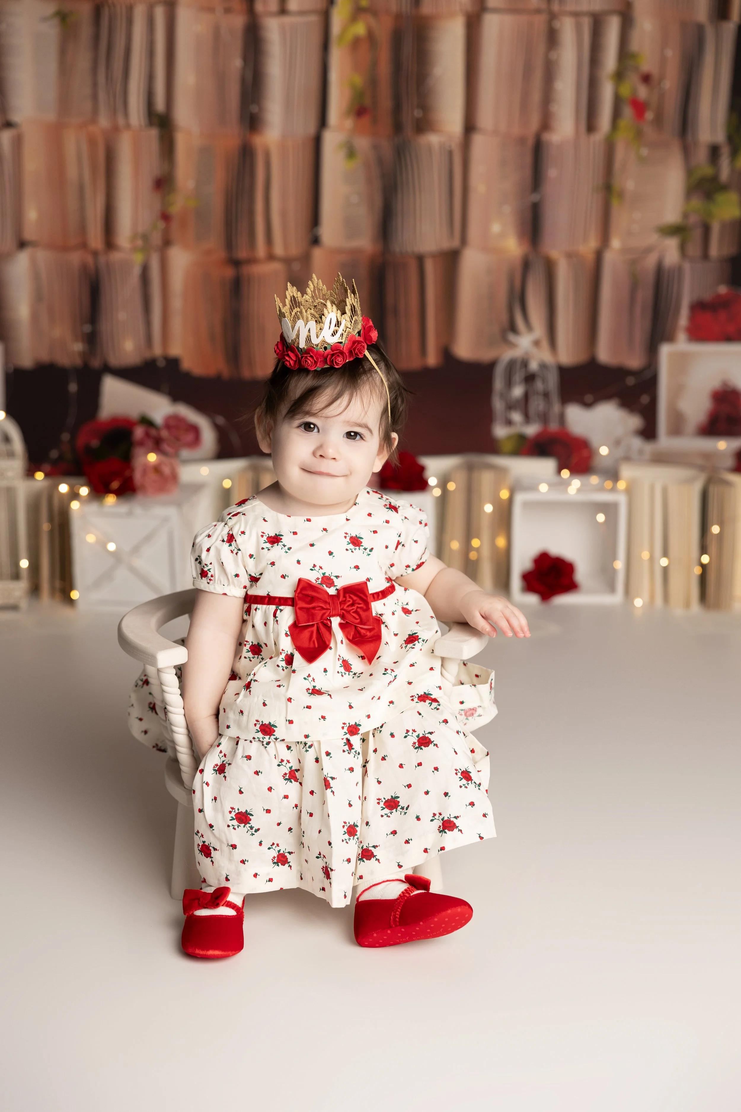 Floral books cake smash theme – first birthday girl portrait with romantic setup