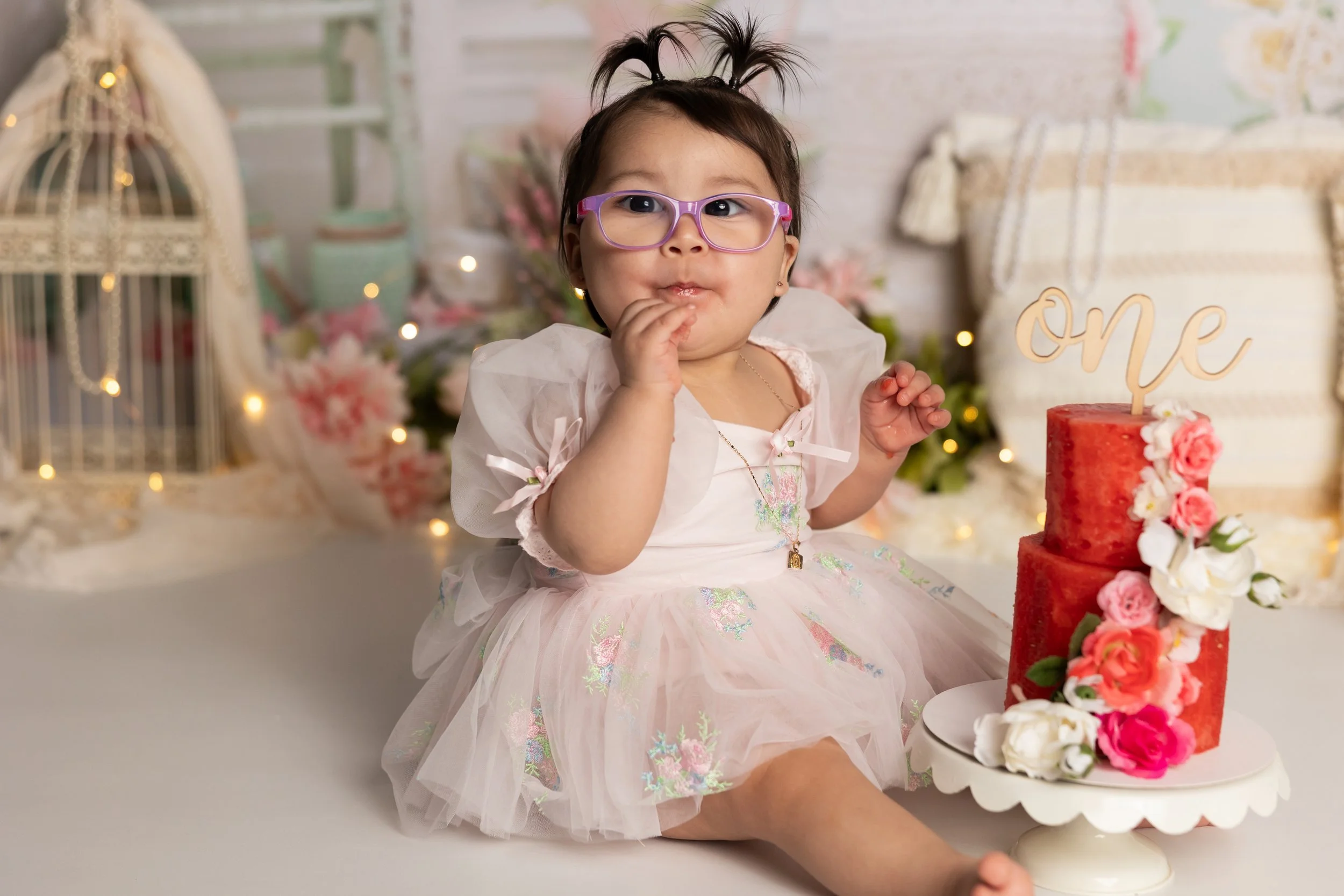 Baby enjoying watermelon cake alternative first birthday photos