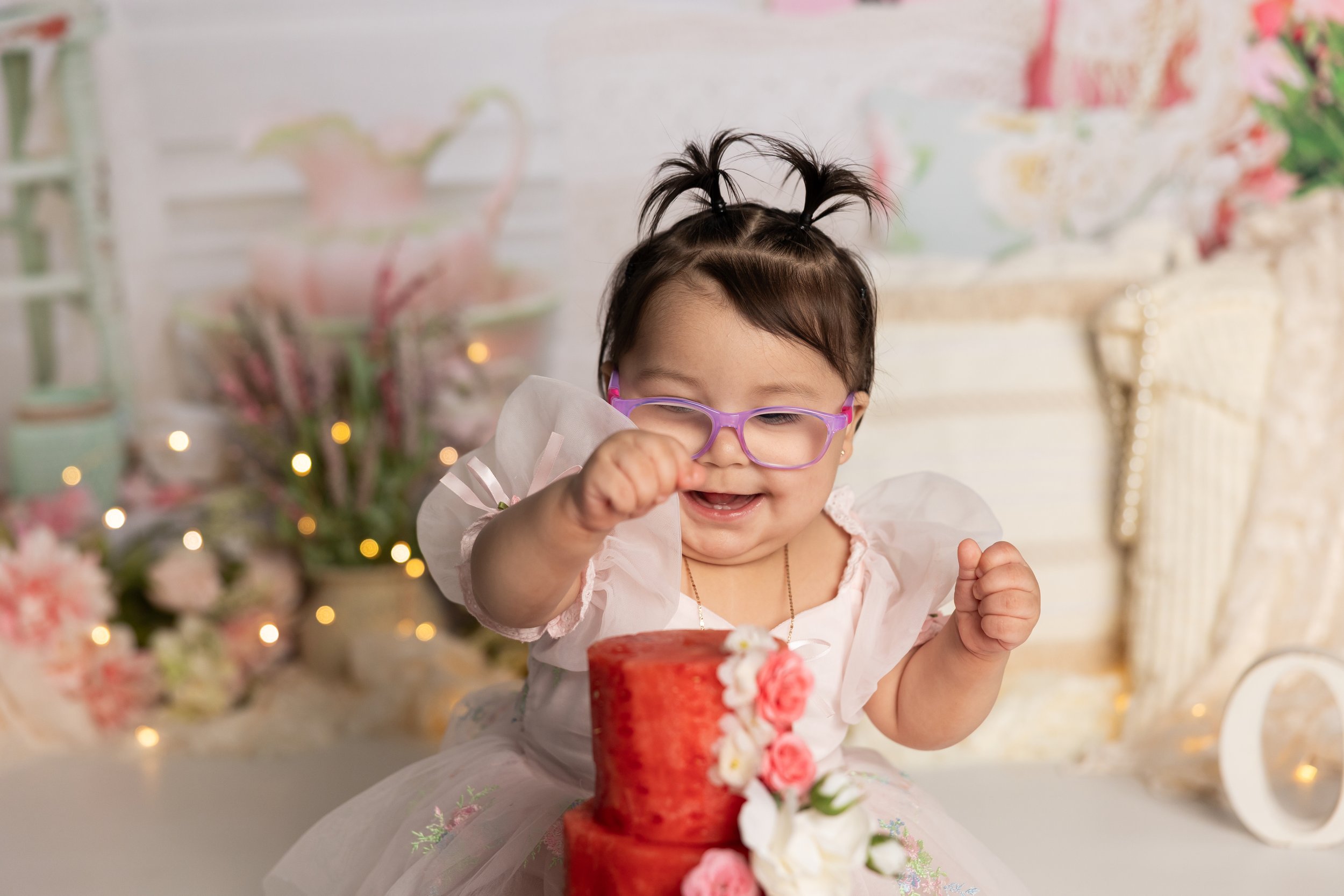 Happy baby reaching for watermelon smash cake alternative Austin