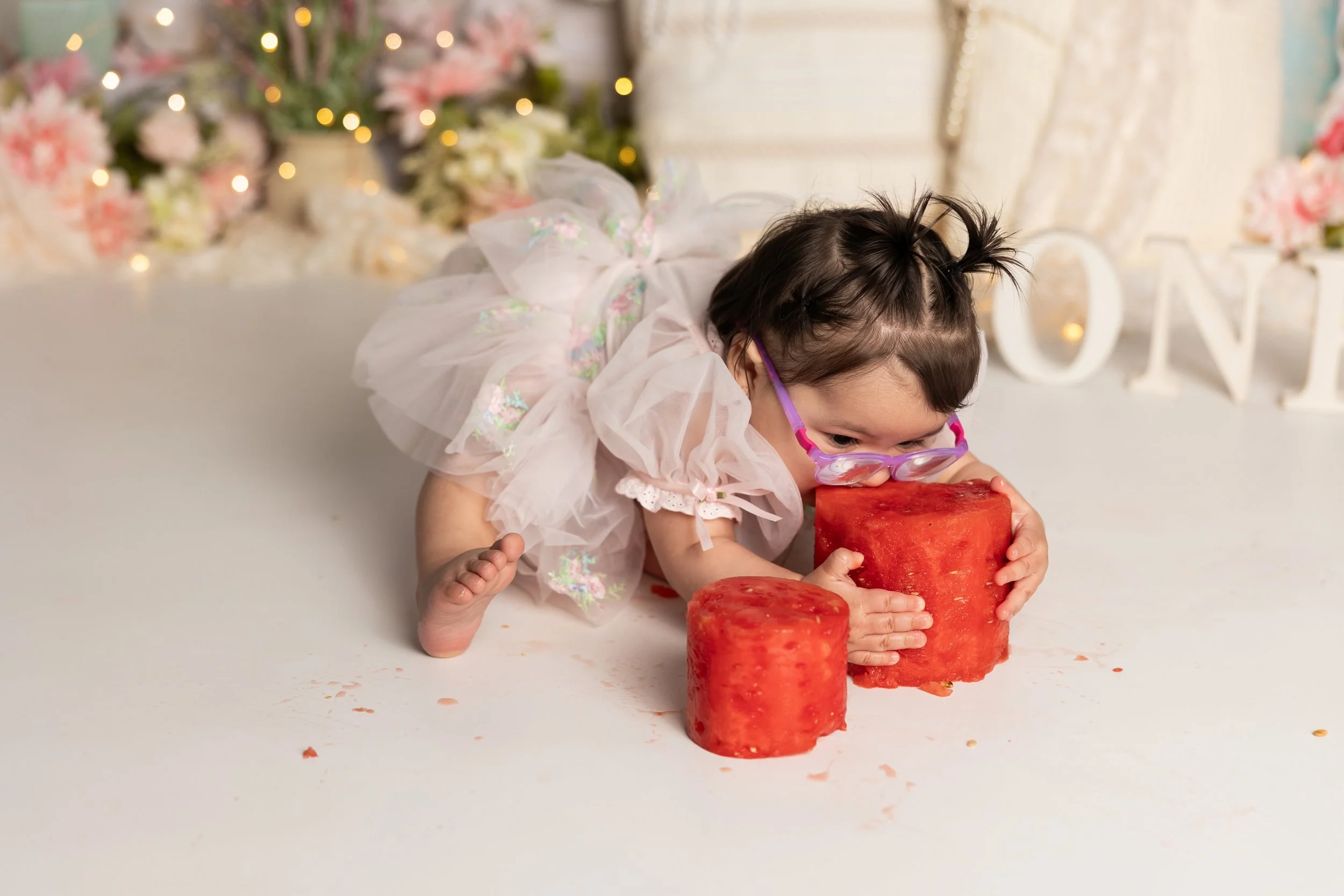 Messy watermelon smash moment baby fully engaged in photoshoot Austin