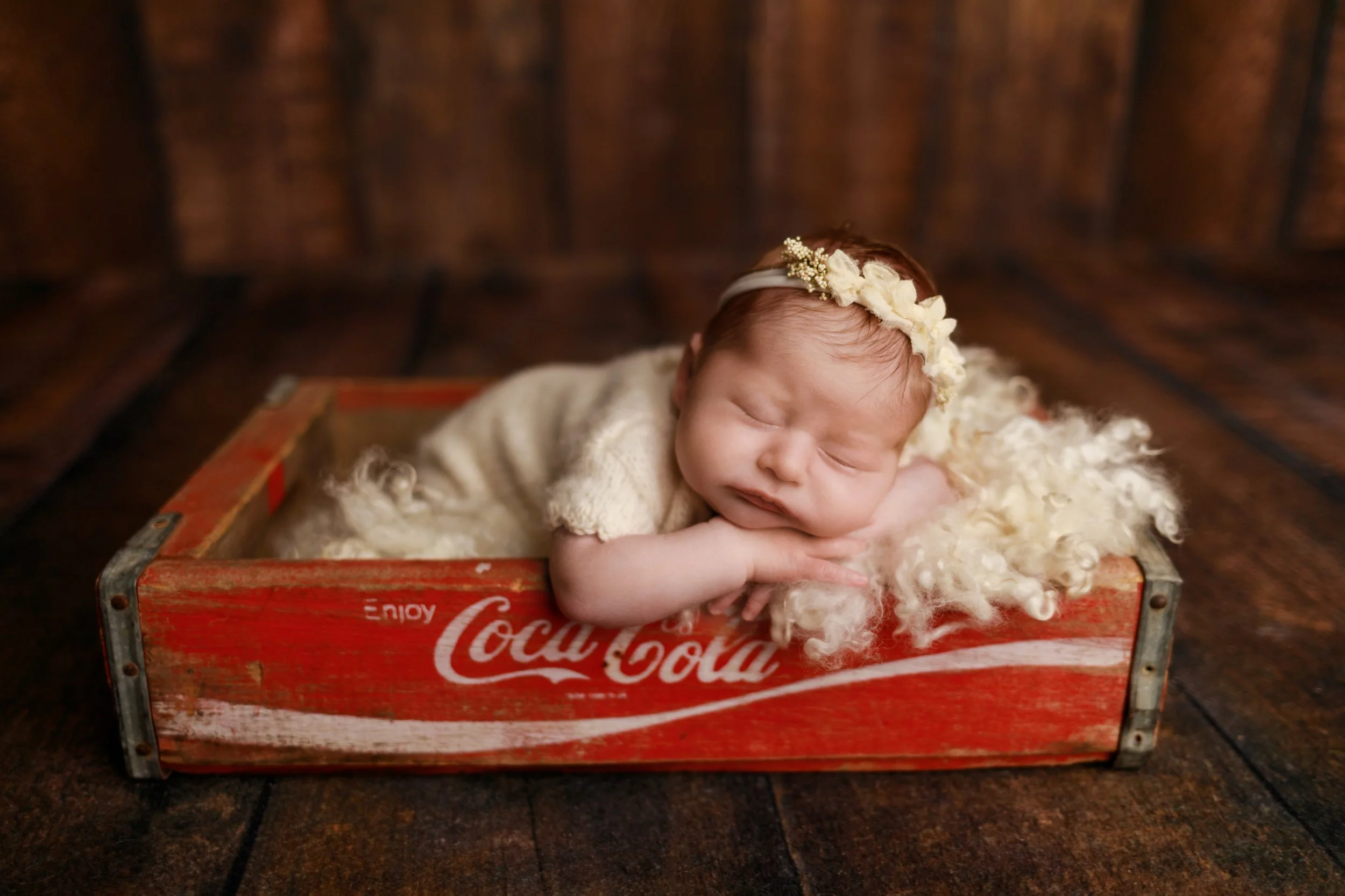 Baby posed in vintage Coca-Cola crate patriotic theme