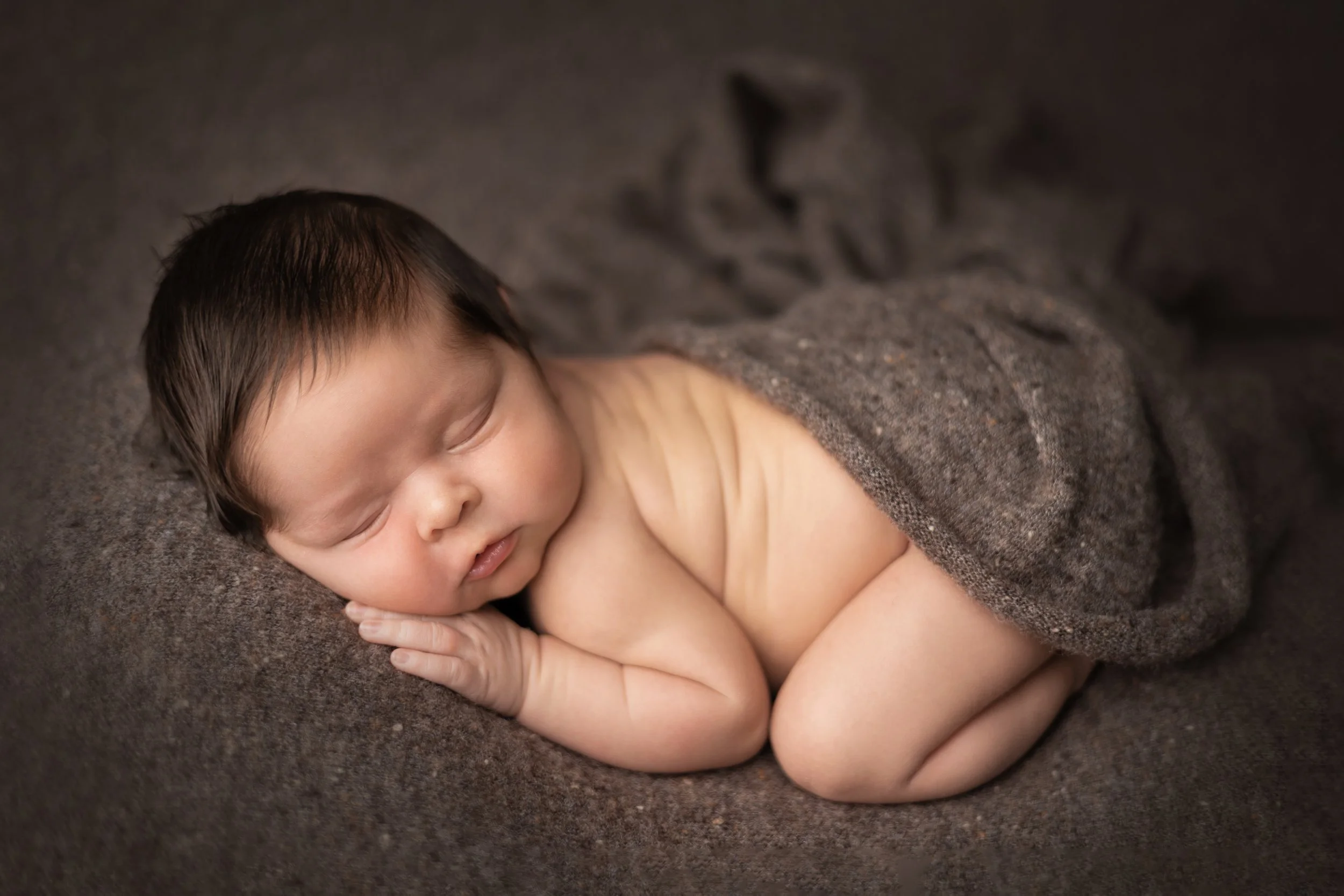 Wrapped Newborn Boy in Soft Neutral Tones