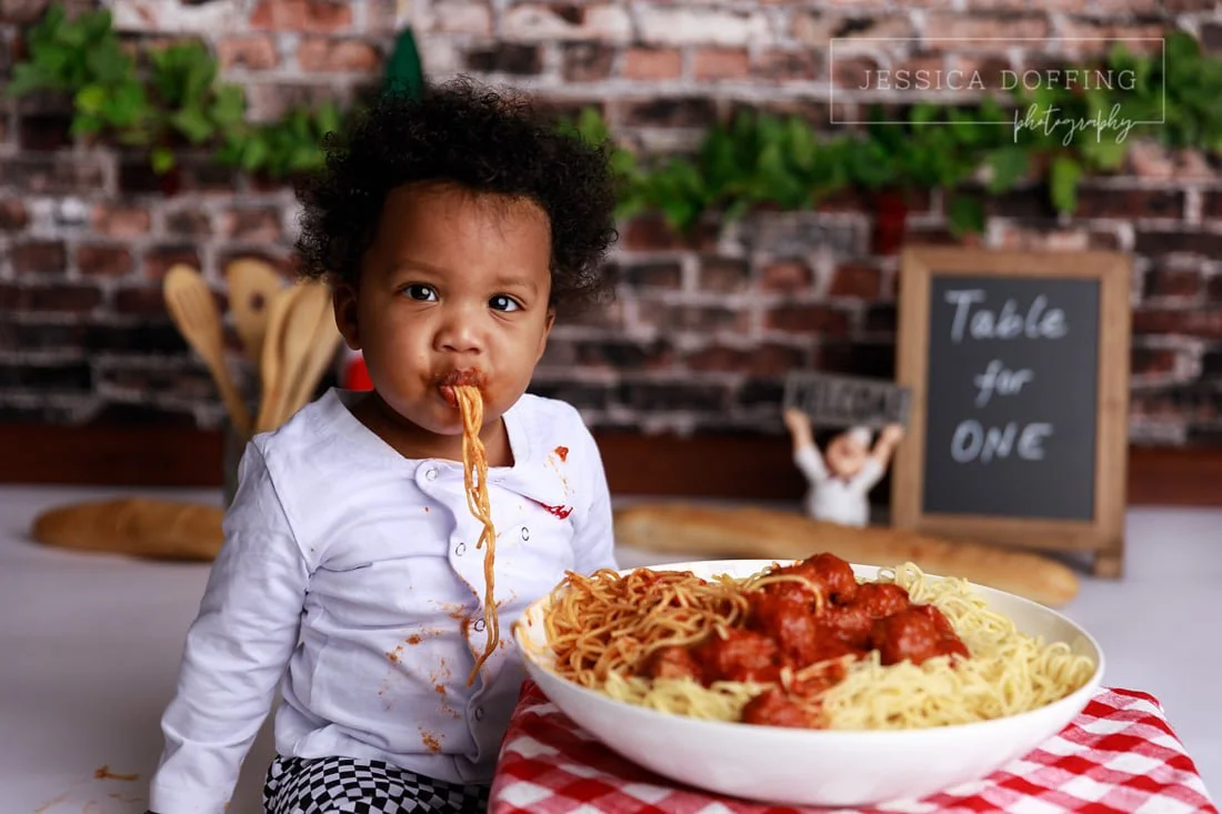Baby Boy Eating Spaghetti During First Birthday Session