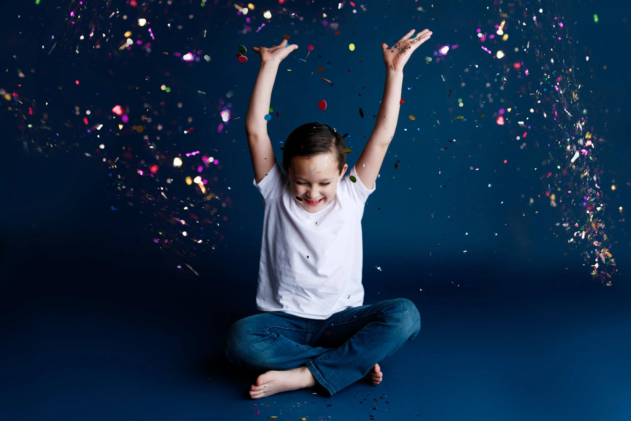 Boy Throwing Confetti in Blue Glitter Photo Session