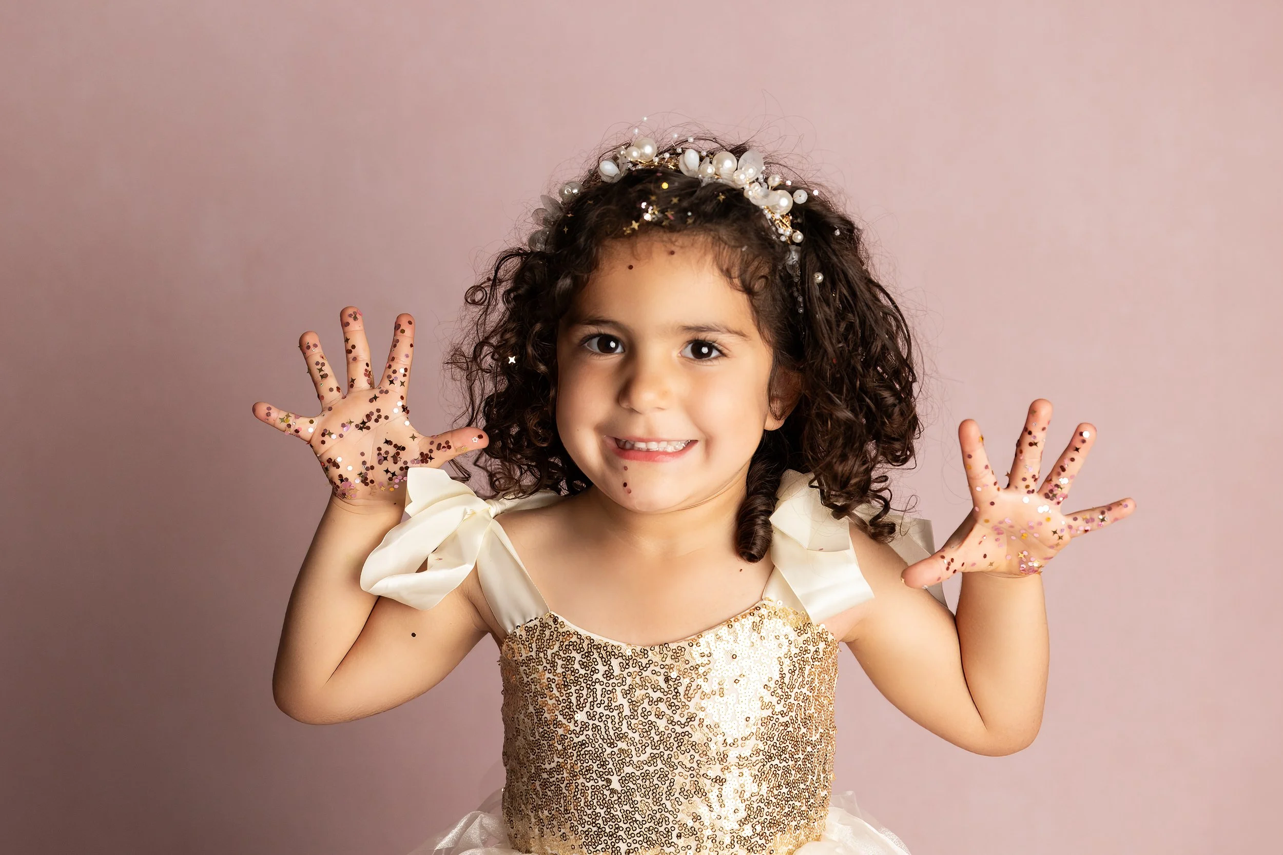 Little Girl Showing Glitter Covered Hands