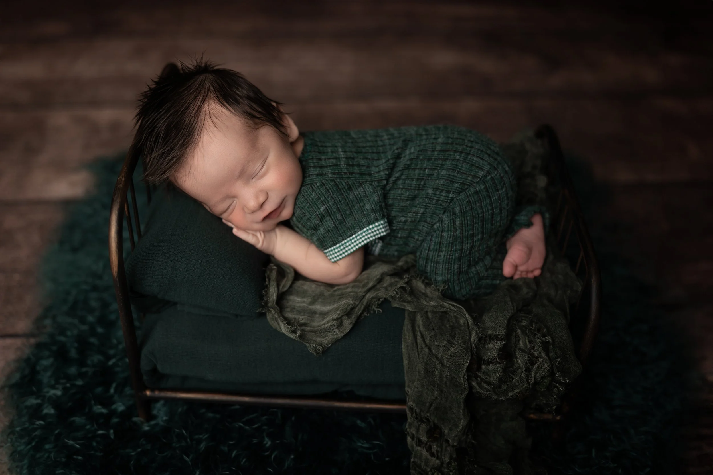 Moody Green Newborn Bed Pose