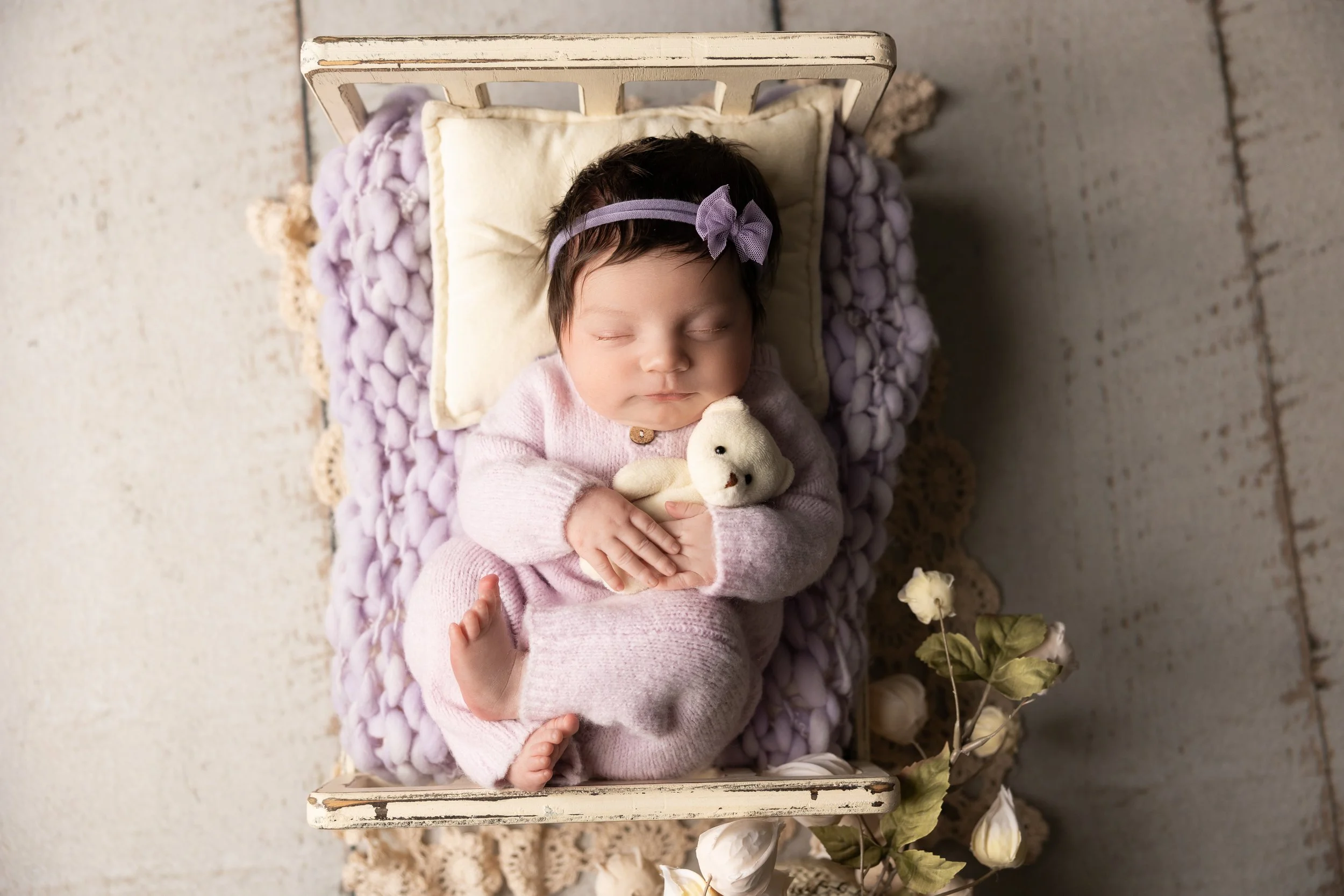 Lavender Newborn Bed Portrait with Teddy Bear