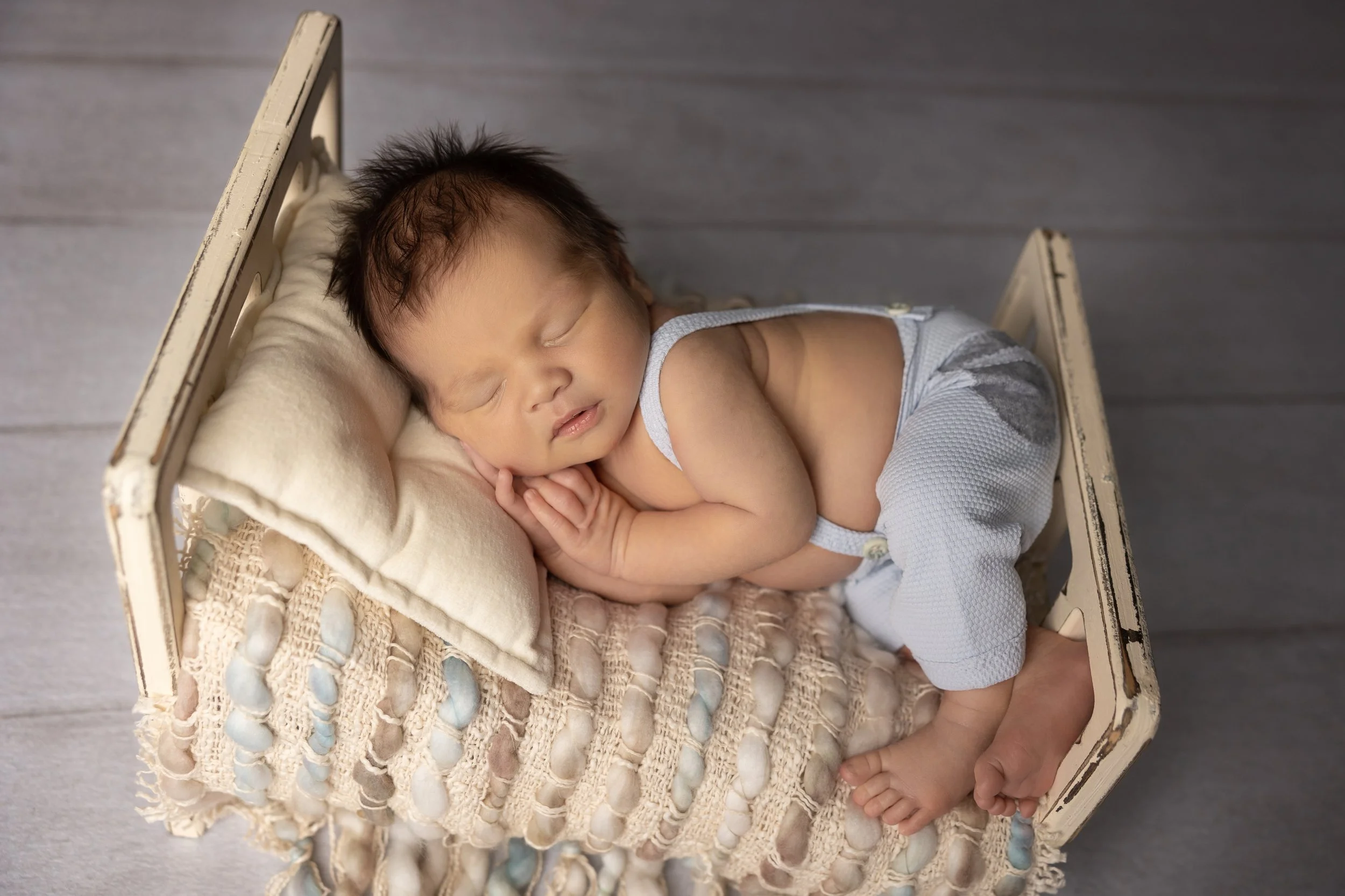 Side-Lying Newborn Bed Pose with Suspenders