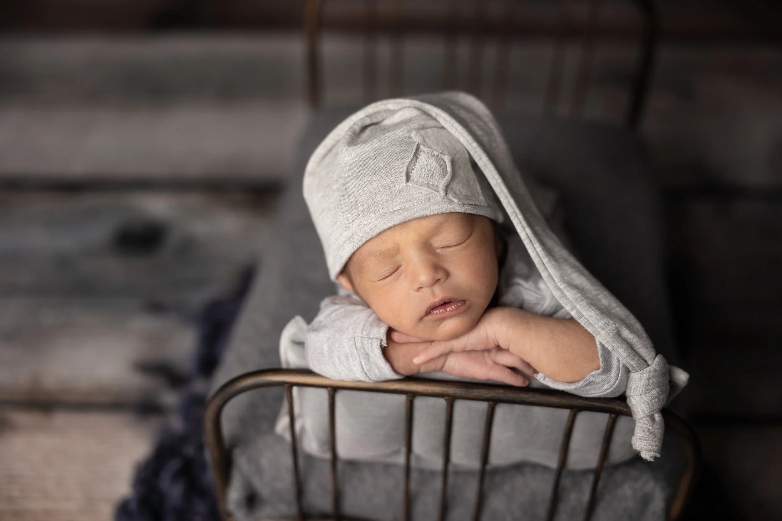 Gray Chin-on-Hands Newborn Portrait