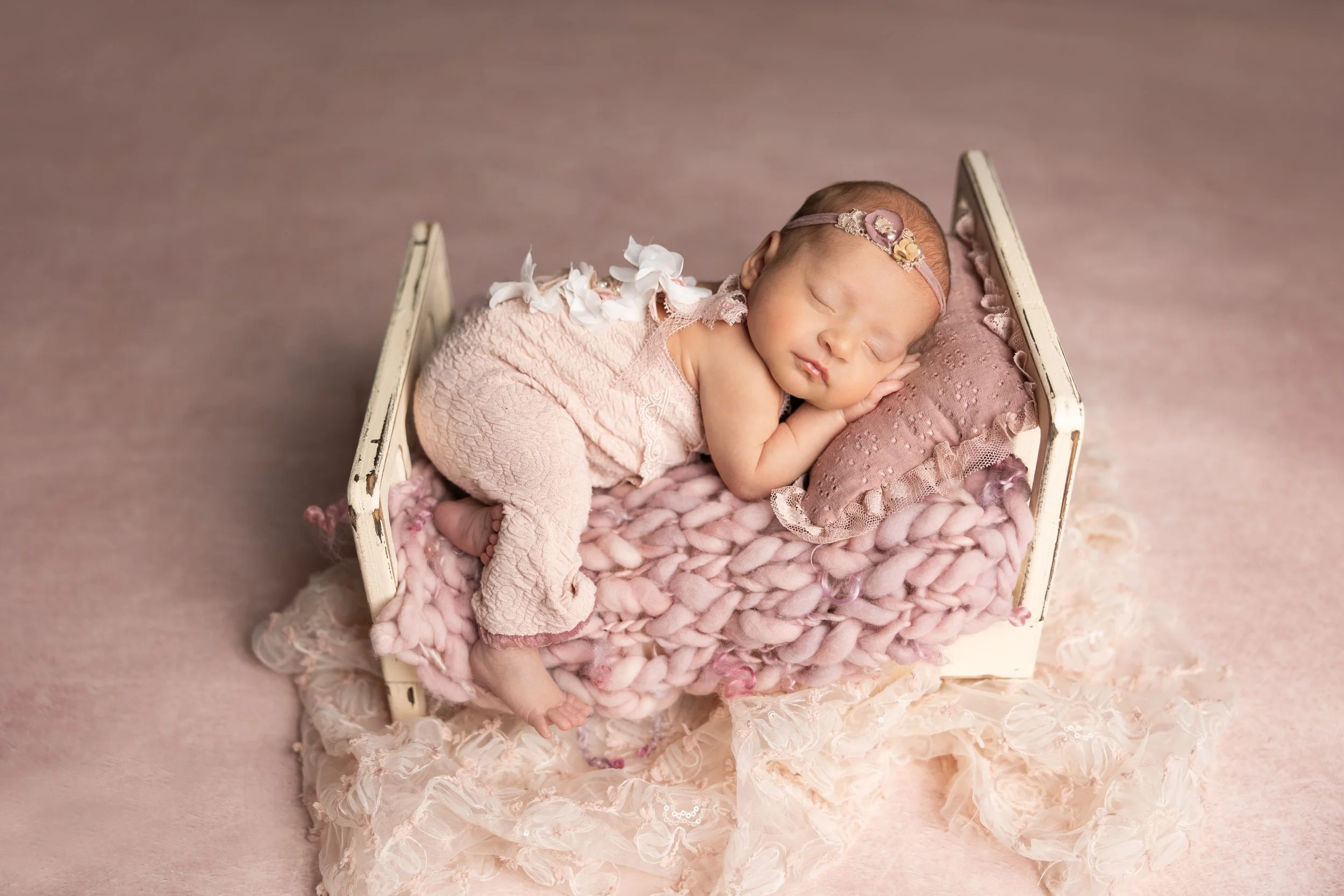 Blush Newborn Bed Pose