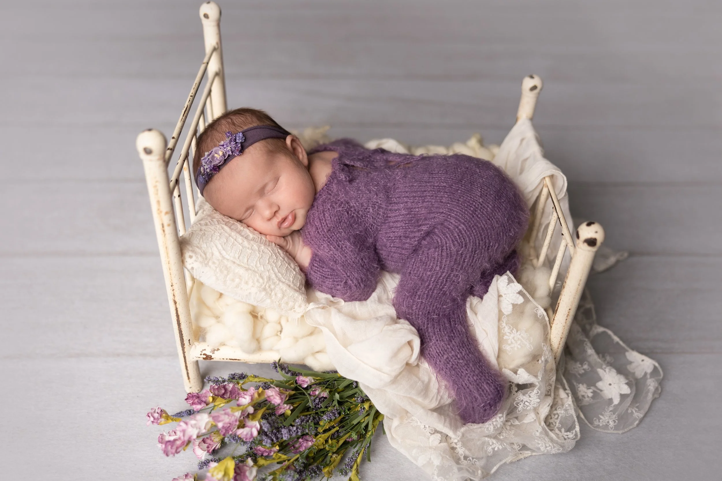 Purple Newborn Bed Portrait with Florals
