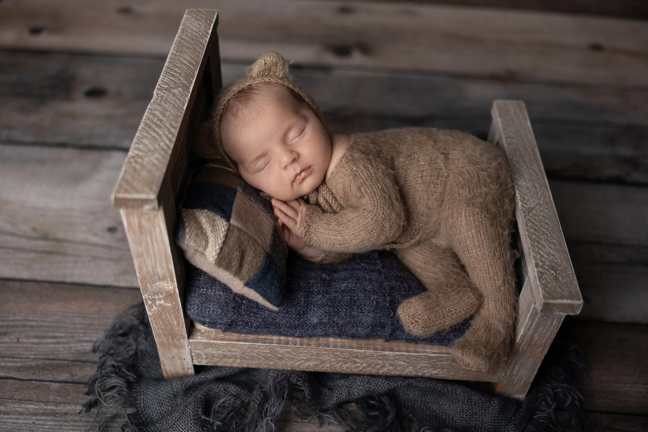 Neutral Newborn Bed Portrait in Brown Knit