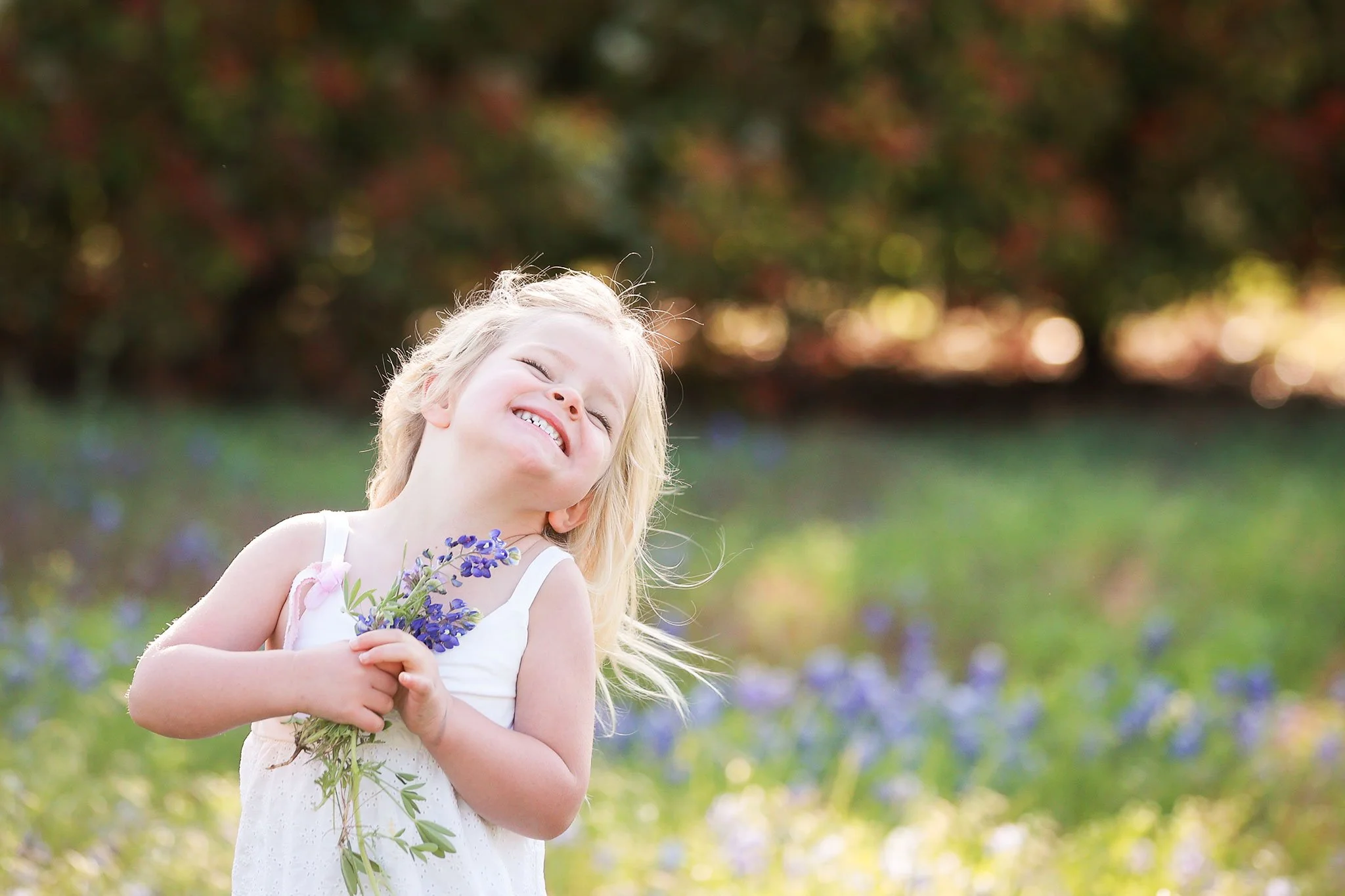 Young girl holding bluebonnets